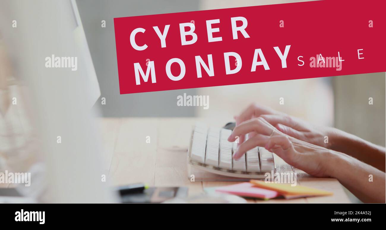 Composition of cyber monday sale text over woman typing on computer keyboard Stock Photo