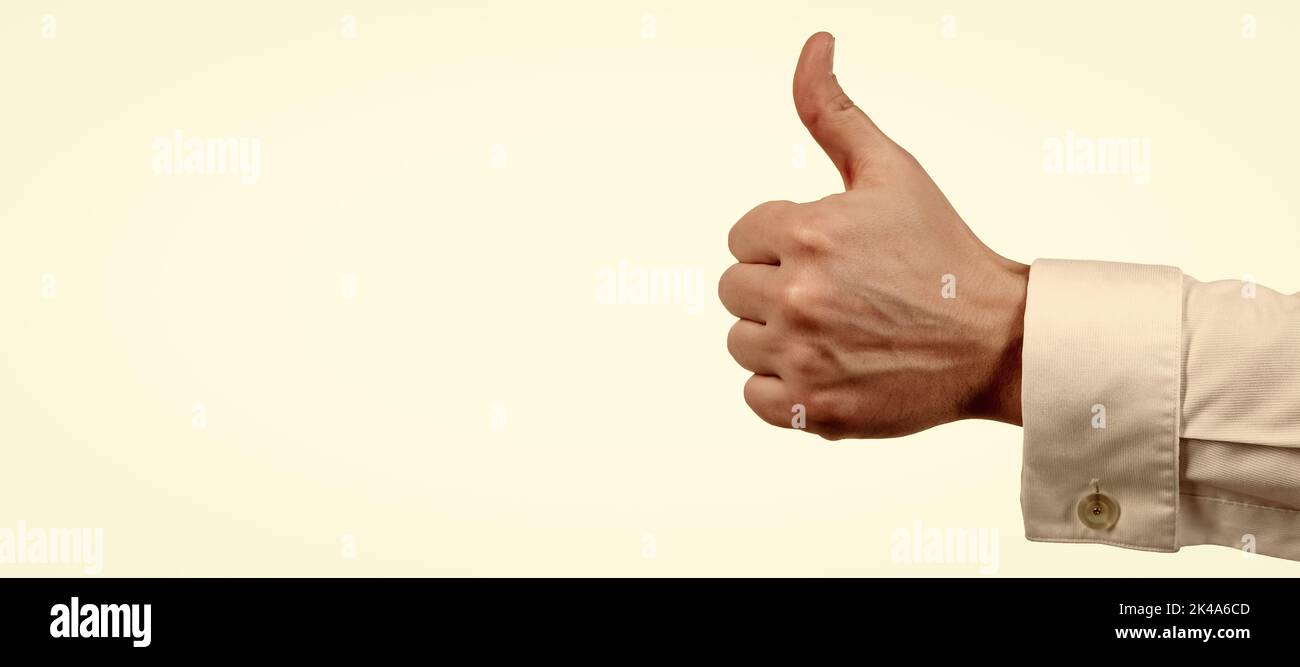 approval gesture of thumb up with male hand isolated on white, approvement. Horizontal poster design. Web banner header, copy space. Stock Photo