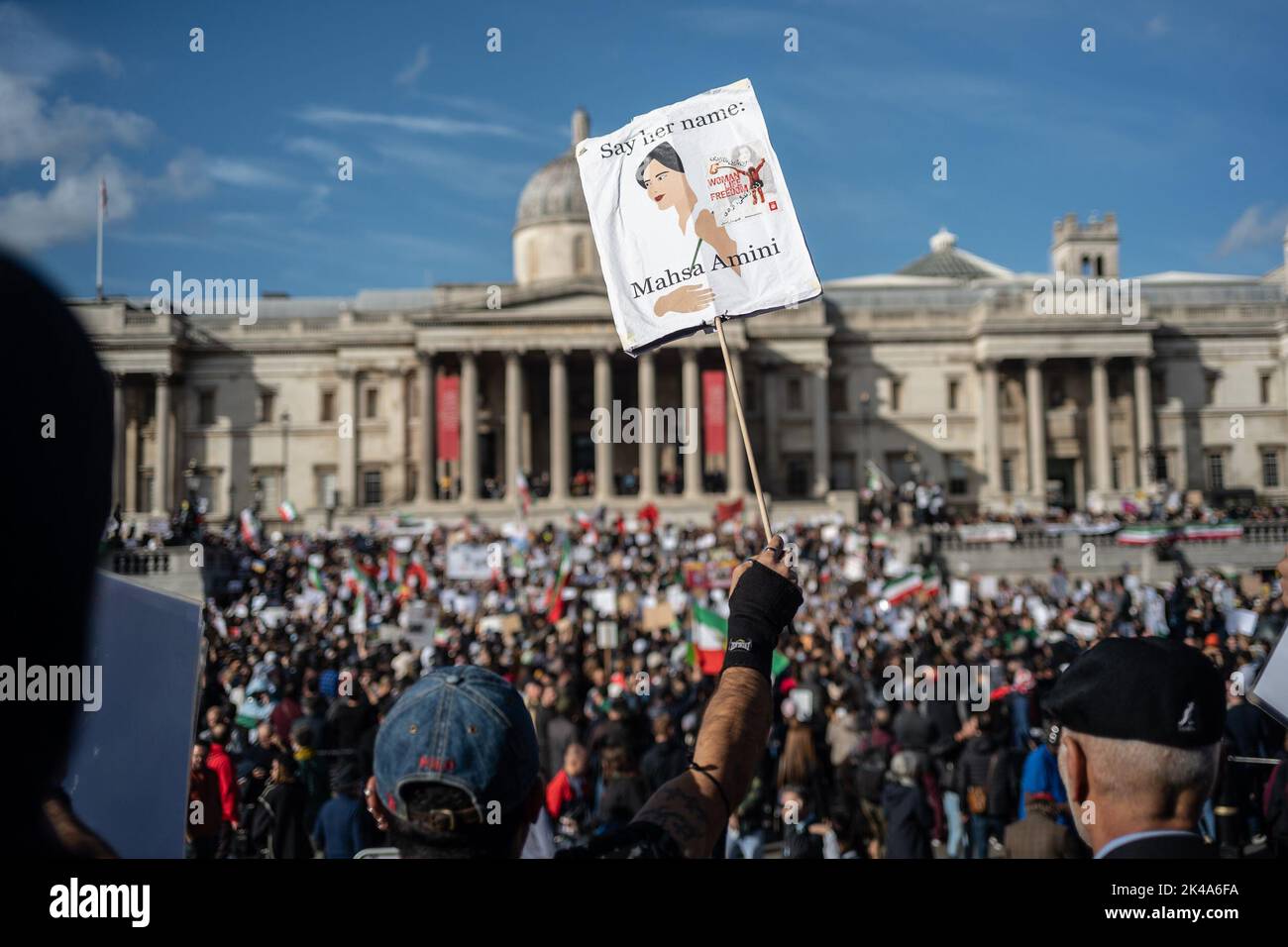 Protestors gathered in Trafalgar Square, demonstrating against the death of Mahsa Amini who died whilst been detained by the Iranian police. Stock Photo