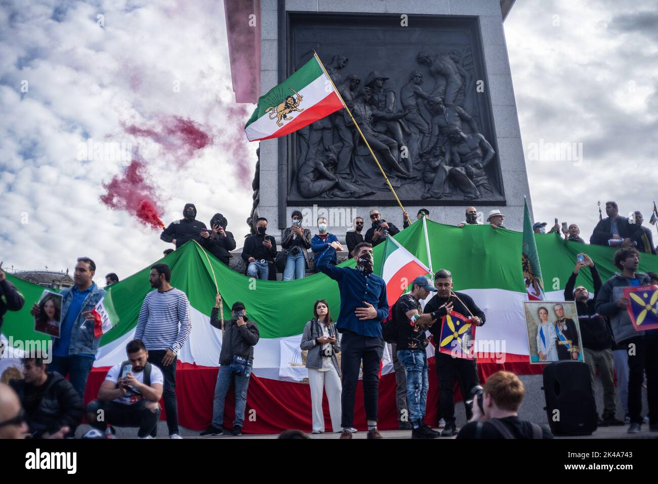 Protestors gathered in Trafalgar Square, demonstrating against the death of Mahsa Amini who died whilst been detained by the Iranian police. Stock Photo