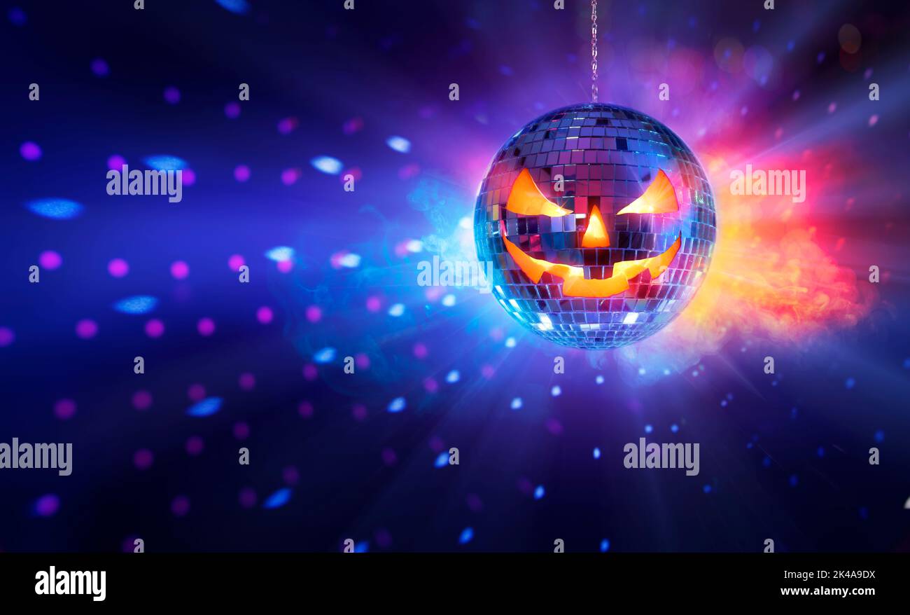 Halloween Mirror Ball In Disco - Pumpkins Face On Sphere In Nightclub With Smoke And Defocused Abstract Lights Stock Photo