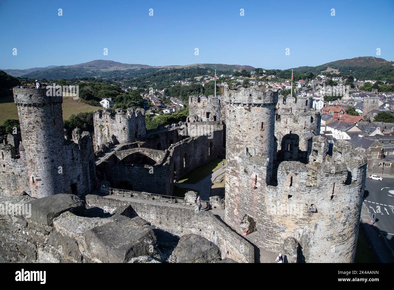 Conwy Castle turrets and battlements looking towards the West and the mountains of Snowdonia in North Wales. Stock Photo
