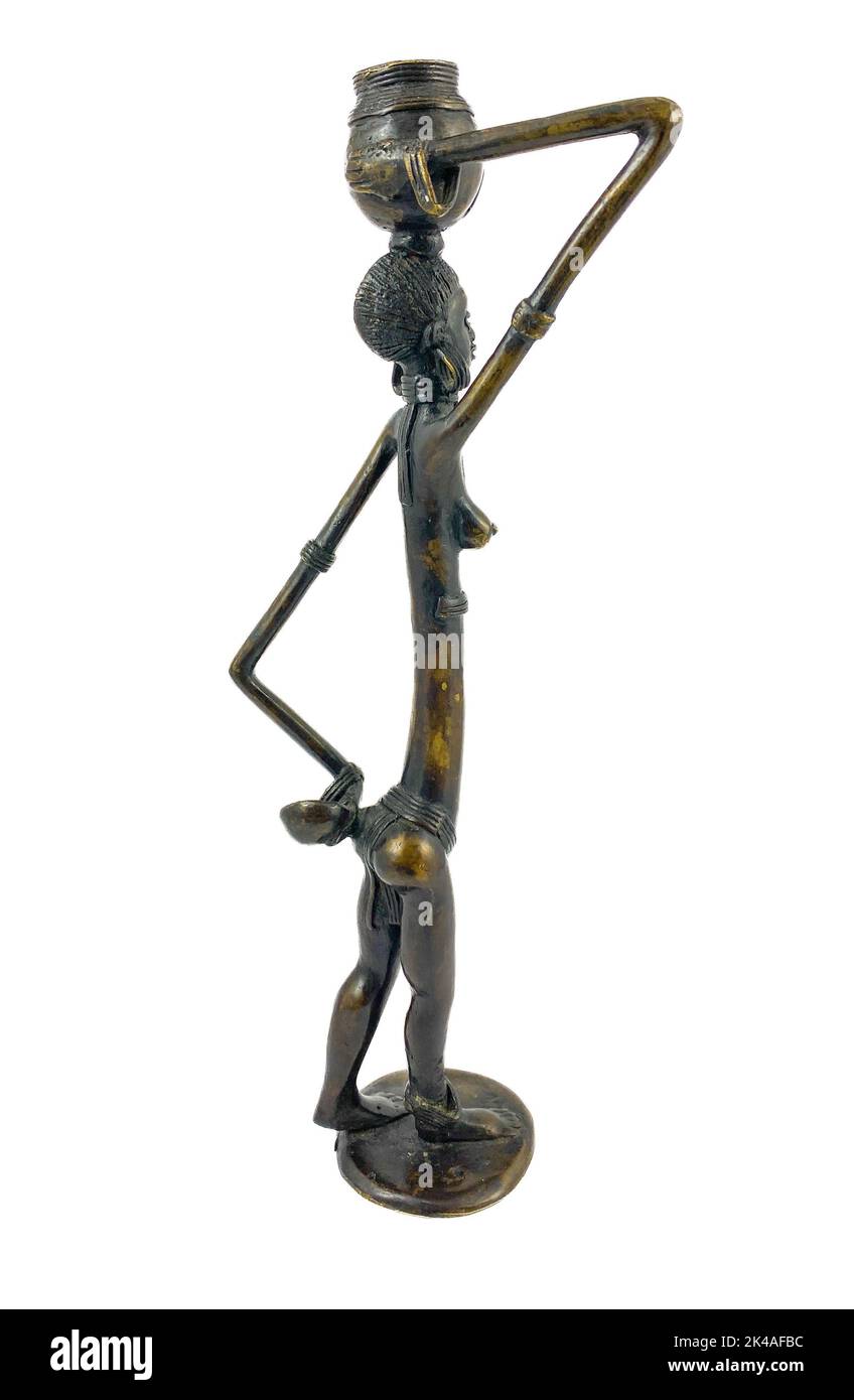 Old african bronze figure with long arms and body on white background