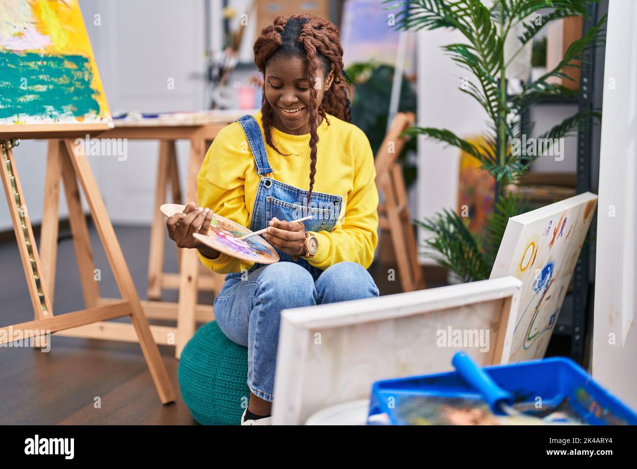 African american woman artist smiling confident drawing at art studio ...