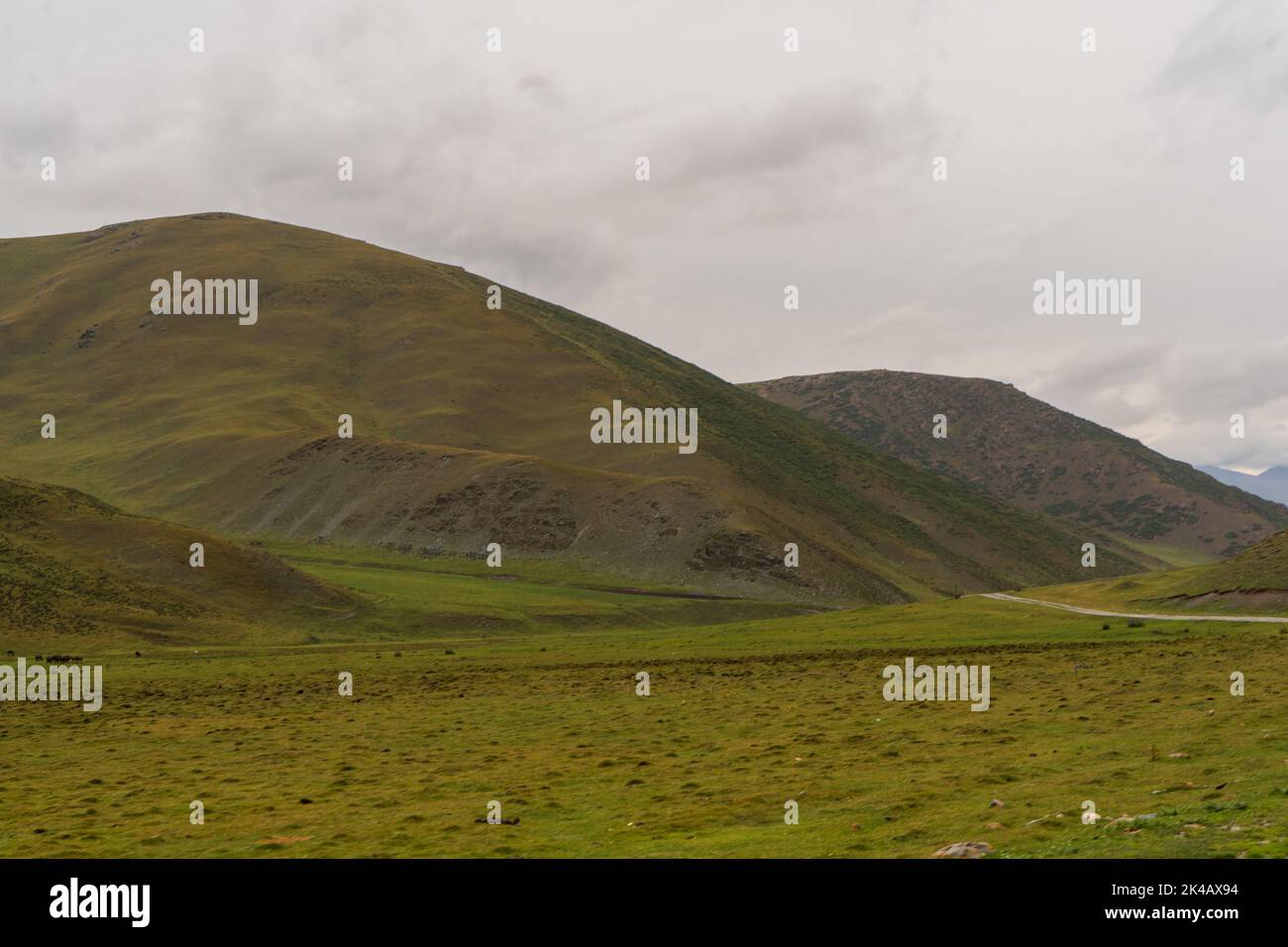 Remote green hills of Karkyra Valley near Sary-Jaz, Kyrgyzstan Stock Photo