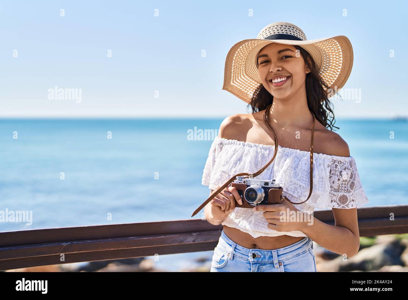 Young african american woman tourist smiling confident using camera at ...