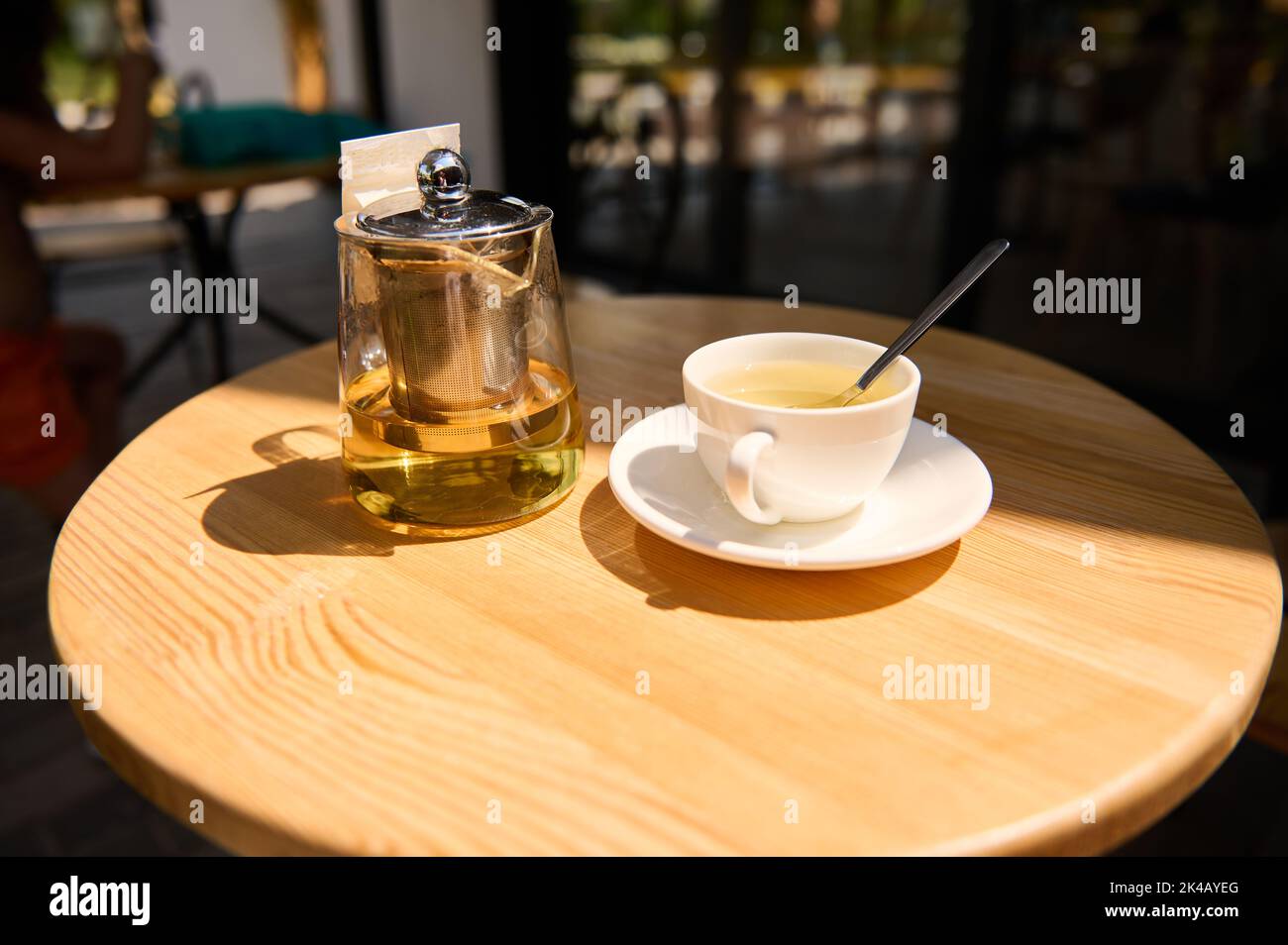 Table Broccoli Tea Teacup and glass teapot with healthy healing and antioxidant herbal tea ...