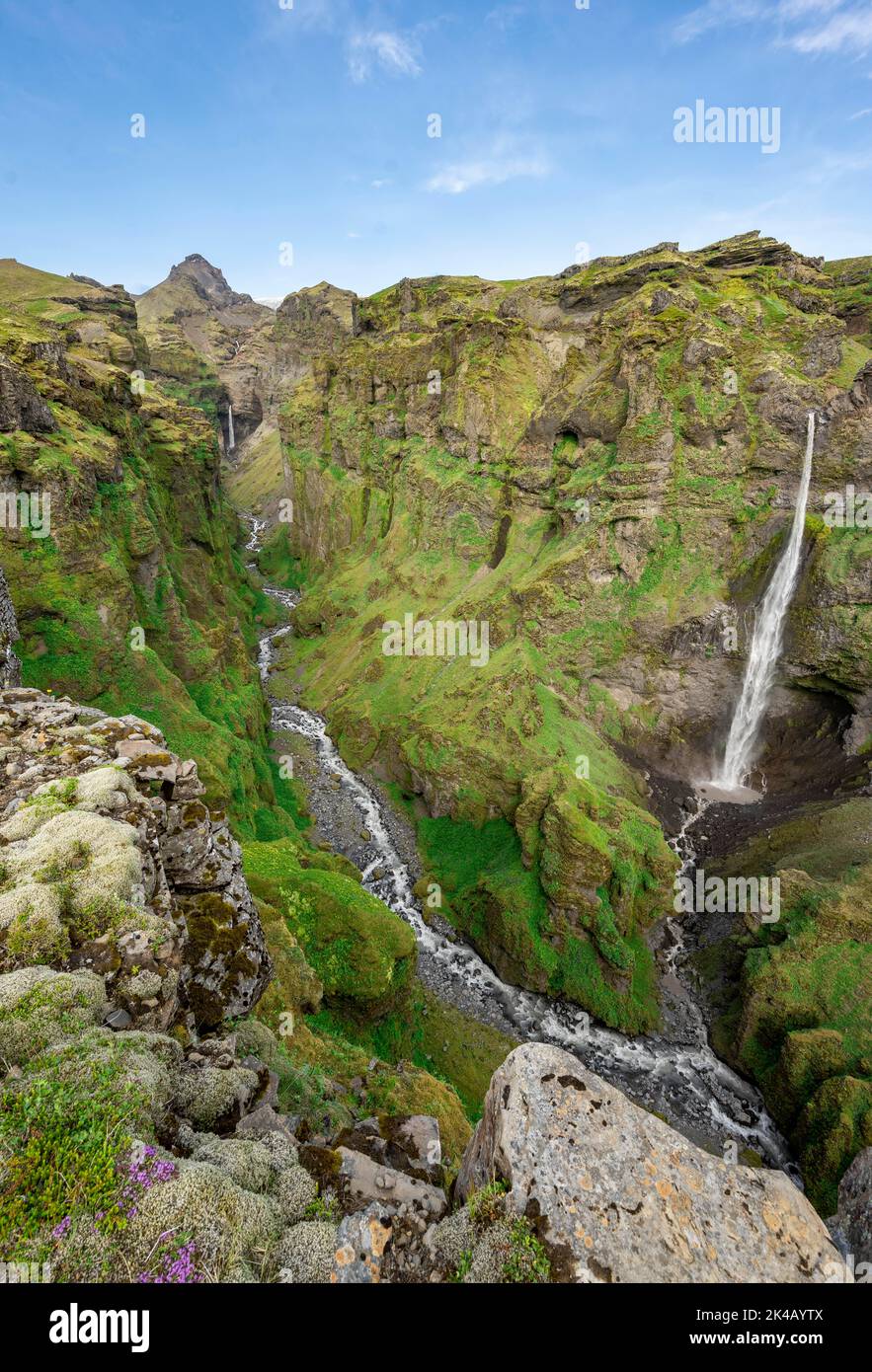 Mountain landscape with canyon, Hangandifoss waterfall in Mulagljufur