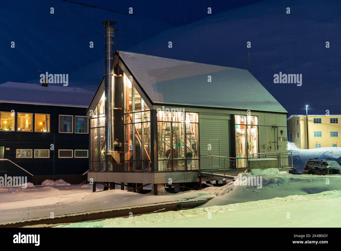 Longyearbyen boiler house on stilts on a cold winter snowy evening