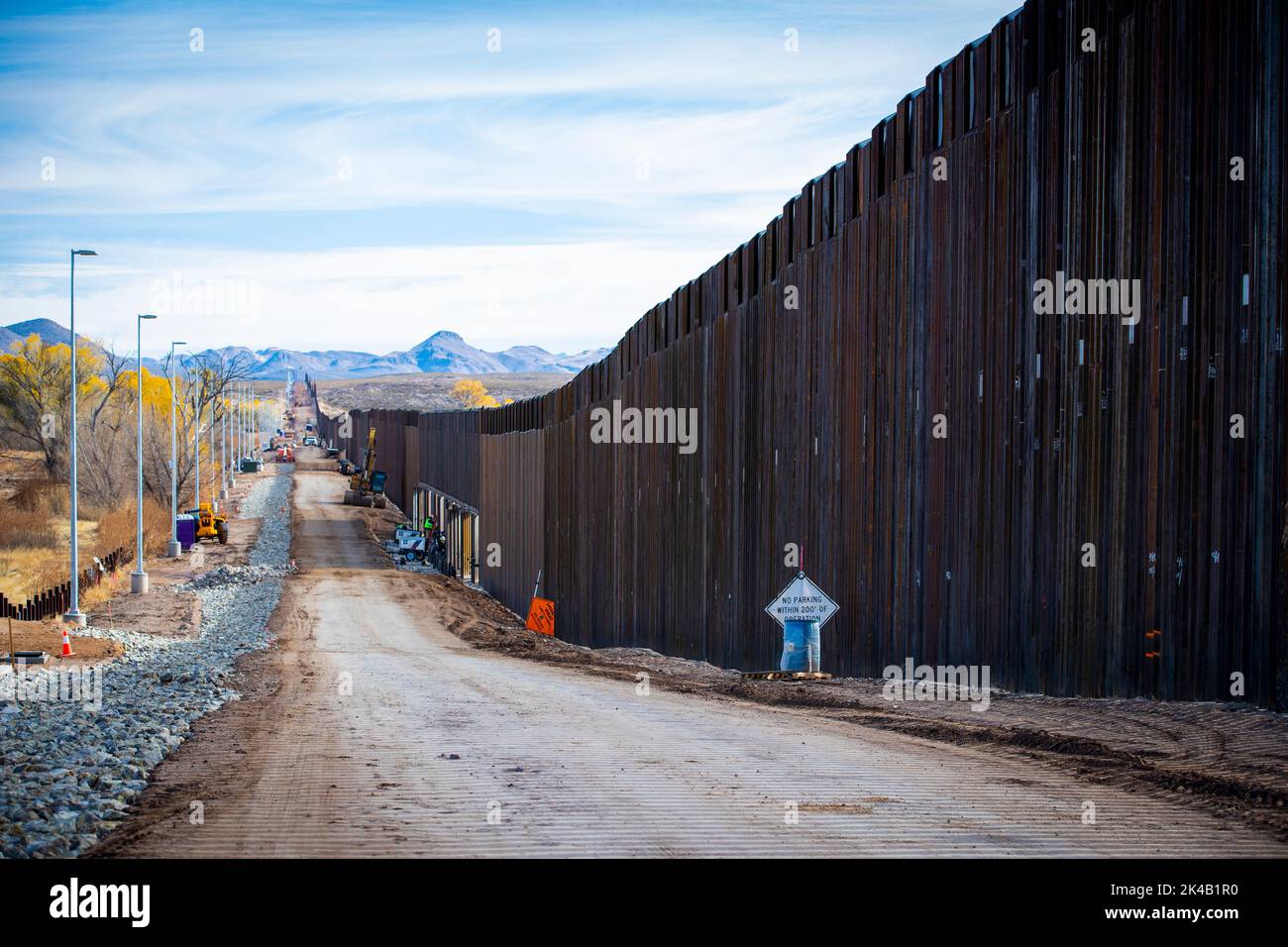 Recently constructed panels at the new border wall system project east of Douglas, Arizona on December 14, 2020. The border wall system includes a combination of infrastructure including new all-weather access roads.  Photo by Jerry Glaser. Stock Photo