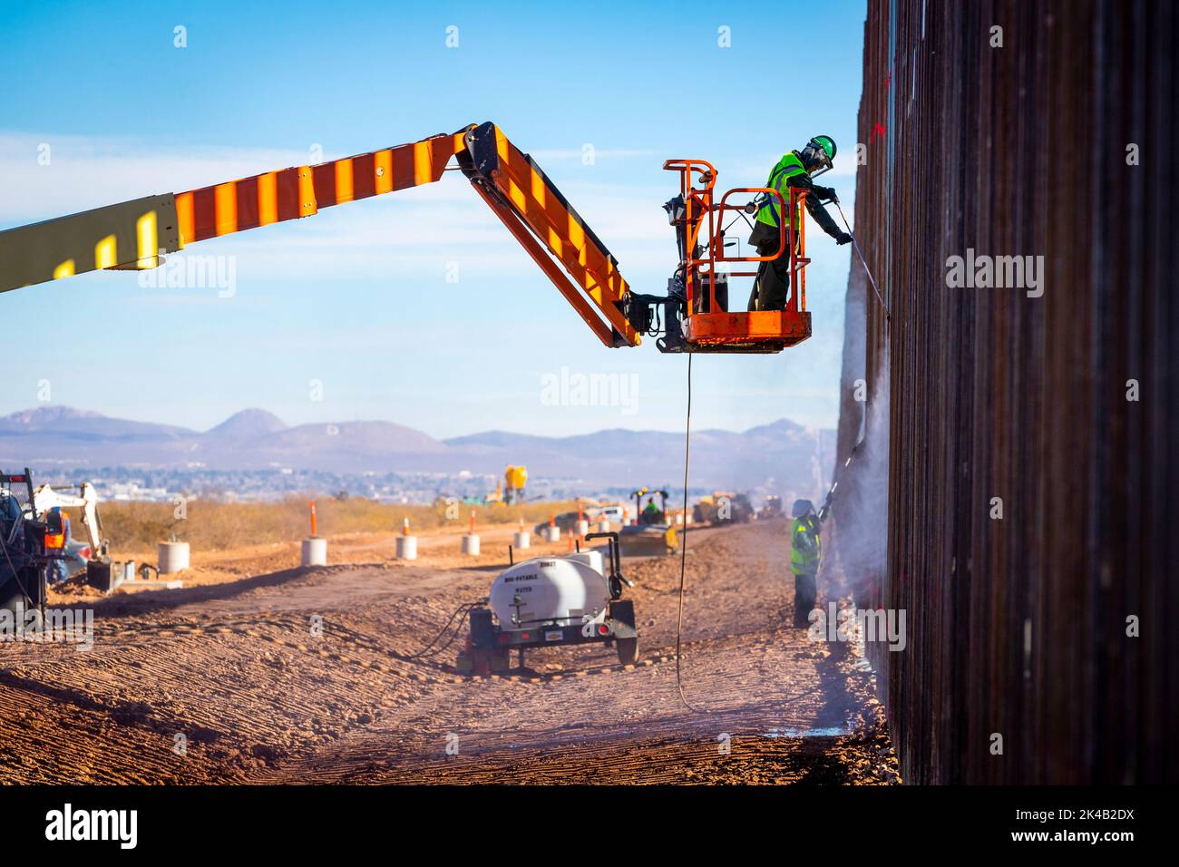 Construction continues on December 14, 2020, on a new border wall system project west of Douglas, Arizona, within U.S. Border Patrol's Tucson Sector. As of December 11, over 425 miles of new border wall system have been built along the southwest border in place of outdated designs, or in locations where no barriers previously existed.  Photo by Jerry Glaser. Stock Photo