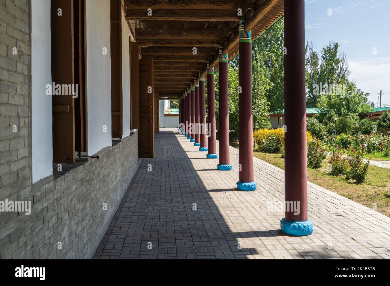 Colourful timber external facade and colonnade of Chinese Dungan Uyghur Mosque in Zharkent, Kazakhstan Stock Photo