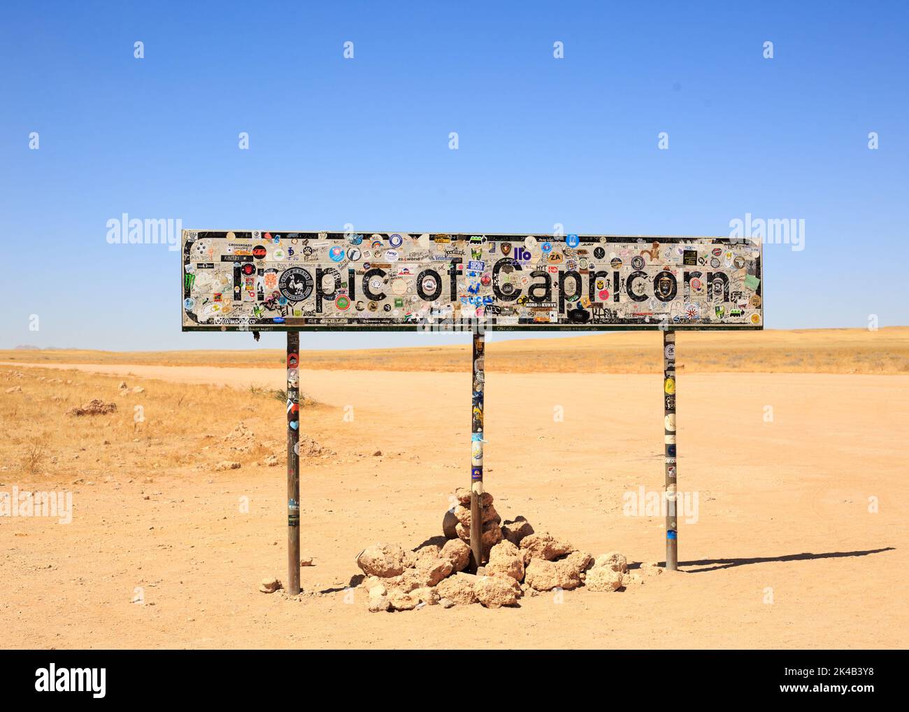 Sossusvlei and Walvis Bay in Namibia, 2022.   A colorful sign depicting The Tropic of Capricorn, the sign describes how you are linked with an imagina Stock Photo