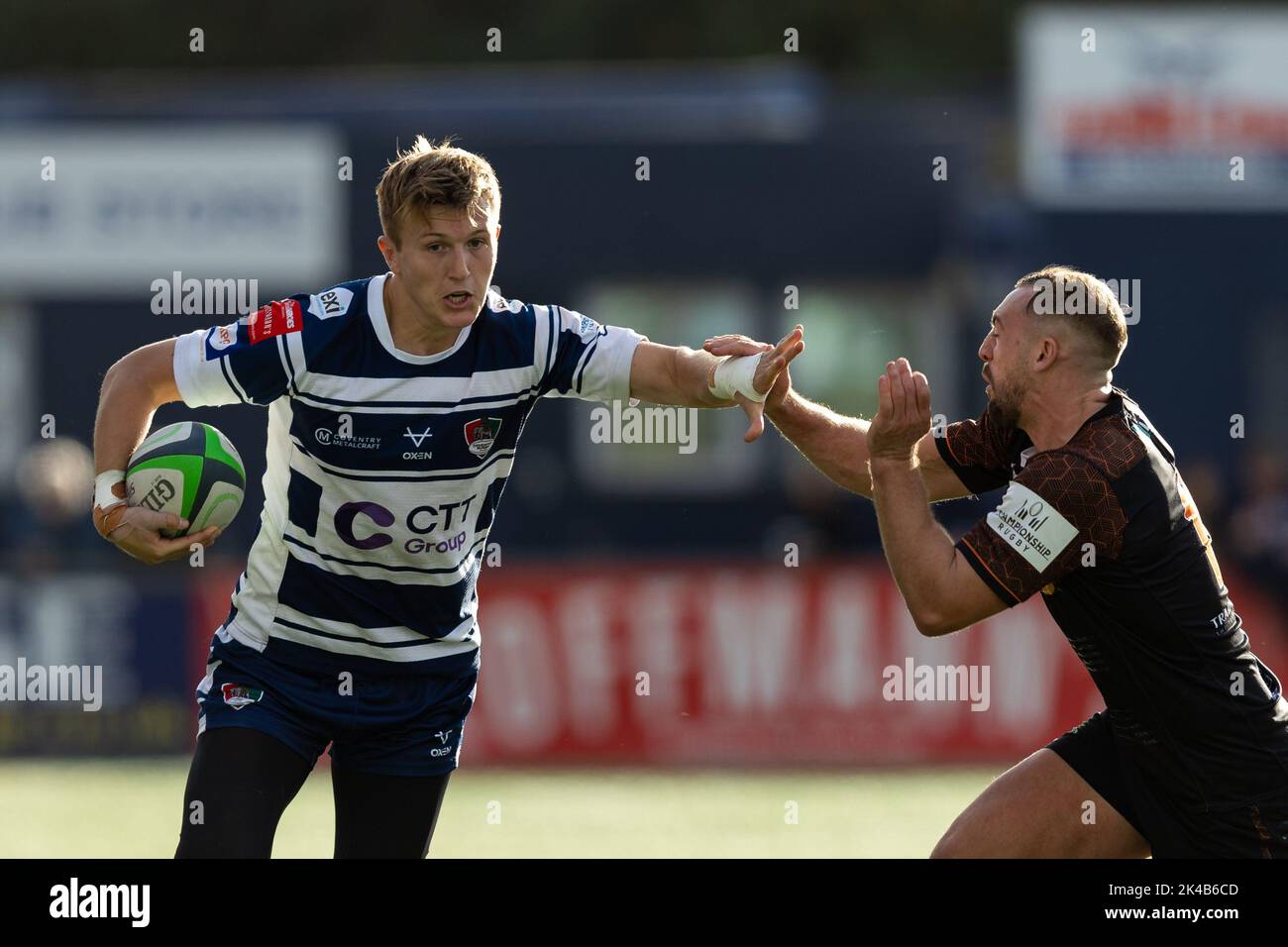 Will TalbotDavies of Coventry Rugby tries to hand off Craig Willis of Ealing Trailfinders