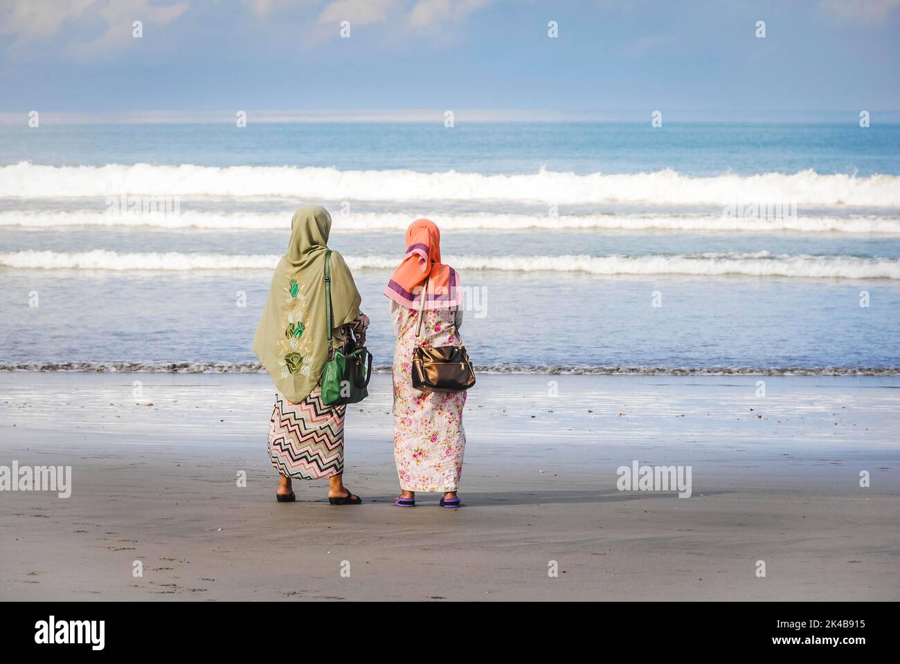 Muslim women at the beach in Bali Stock Photo