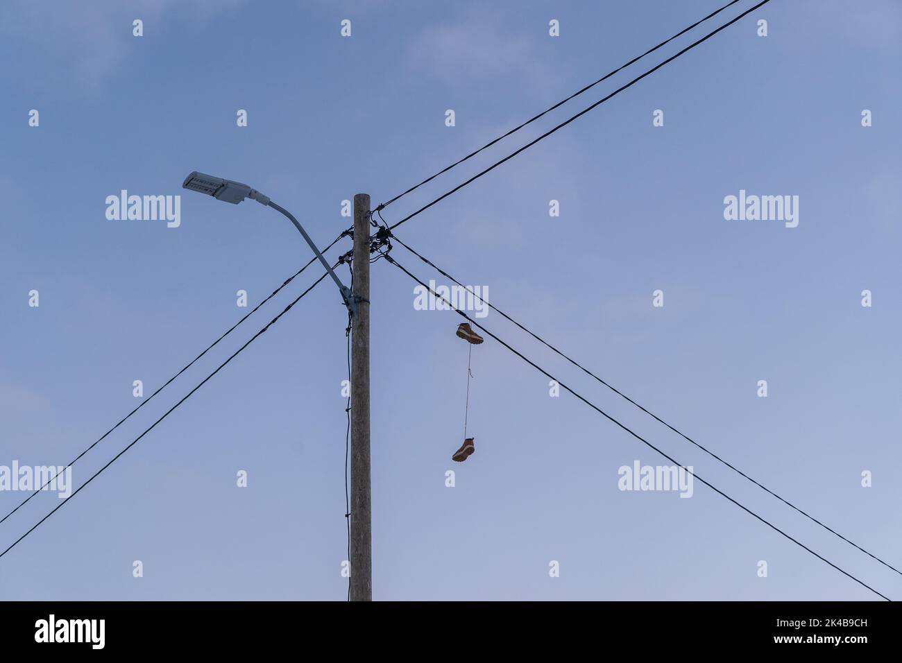 Hanging shoes from cables, perhaps the northern-most Stock Photo