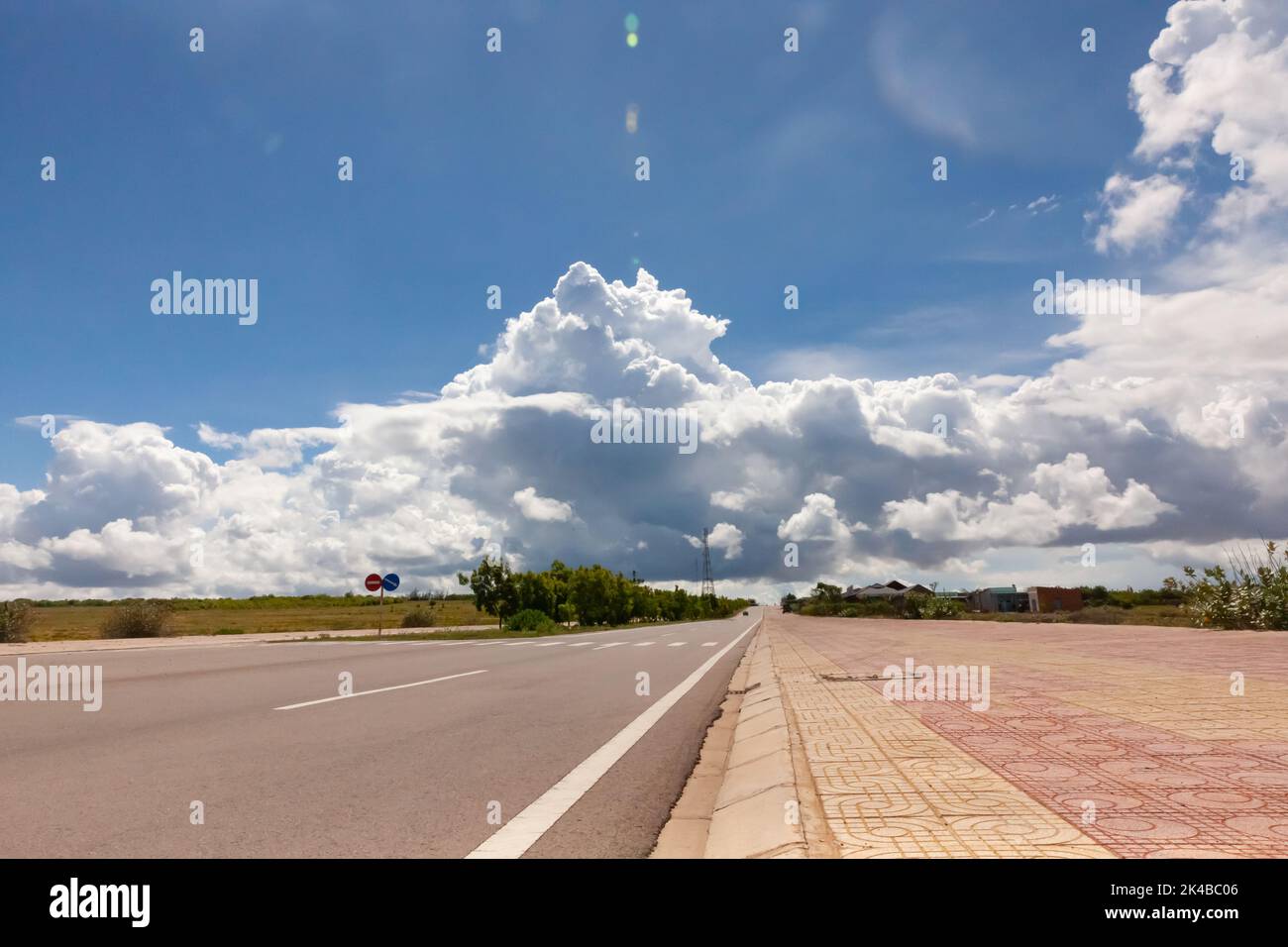 Coastal road in Phan Thiet, Mui Ne, Viet Nam. beautiful landsacpe with blue sky and white cloud in summer day Stock Photo