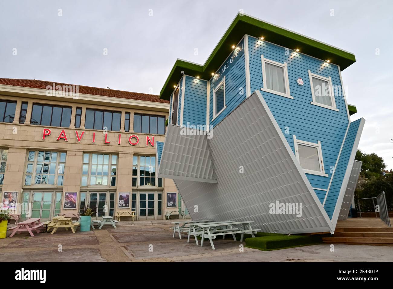 Bournemouth, Dorset, UK, Saturday 1st October 2022. An upside down house outside the Pavilion Theatre is part of the annual Arts by The Sea Festival. Credit: Paul Biggins/Alamy Live News Stock Photo