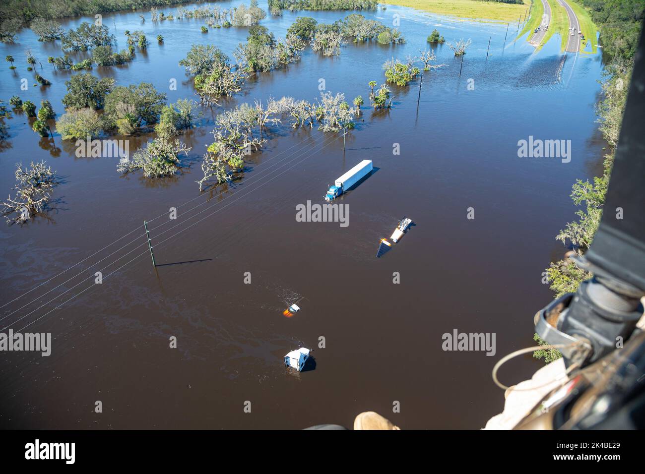 Fort Myers, United States. 30th Sep, 2022. A U.S. Customs and Border Patrol helicopter provides an aerial view of homes and vehicles submerged in floodwaters in the aftermath of the massive Category 4 Hurricane Ian, September 30, 2022 in Fort Myers, Florida. Credit: Ozzy Trevino/US Customs Border Patrol/Alamy Live News Stock Photo