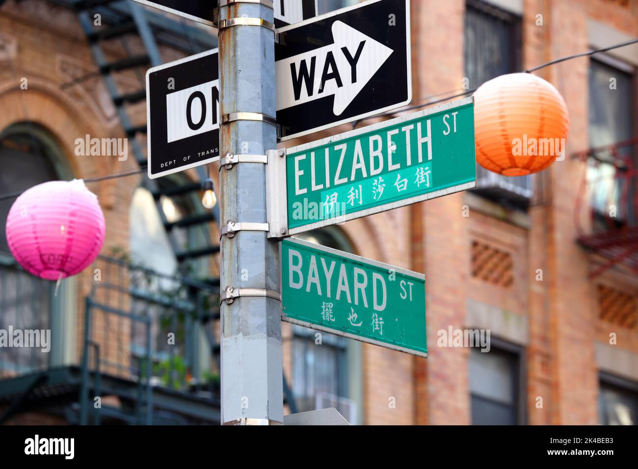 NYC bilingual street signs Elizabeth St and Bayard St in Manhattan Chinatown, New York. The Chinese translation is phonetic. Stock Photo