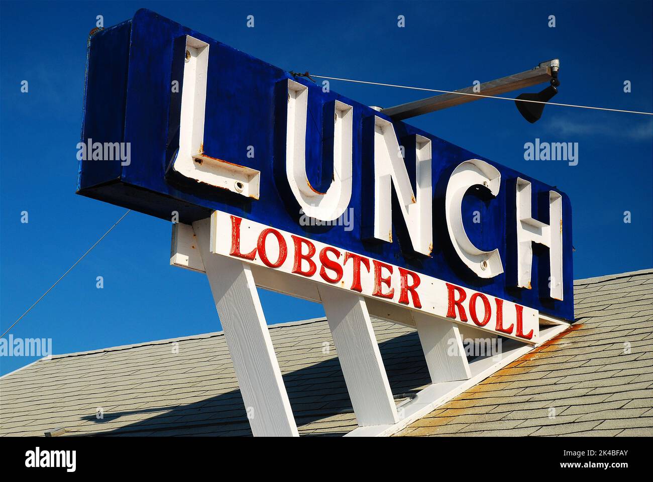 A seafood diner advertises their lunch meal and the specialty of a lobster roll on the East End of Long Island Stock Photo