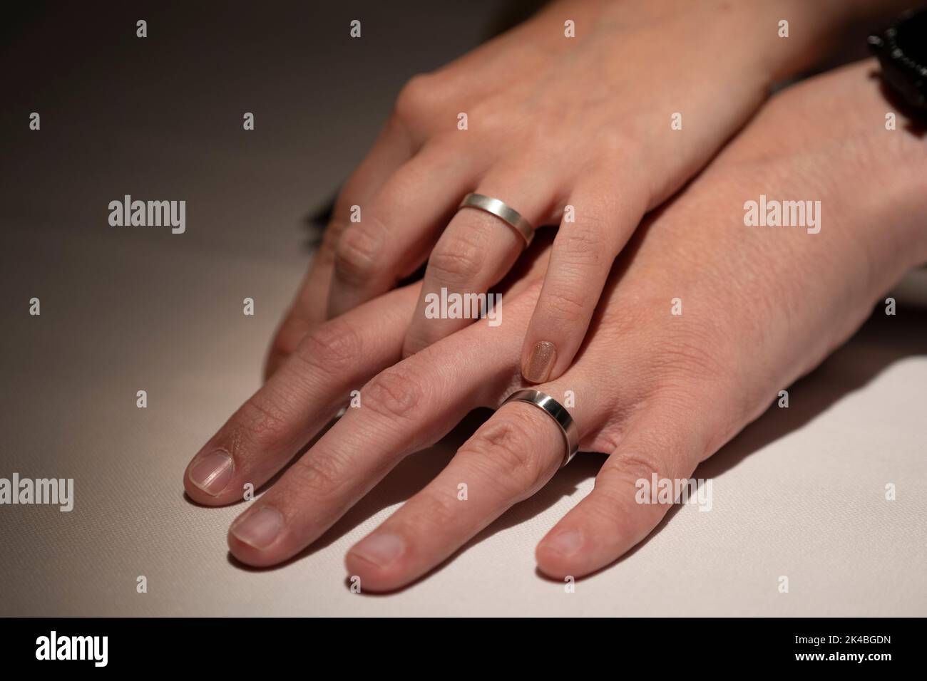 Just married couple holding hand with wedding rings Stock Photo Alamy