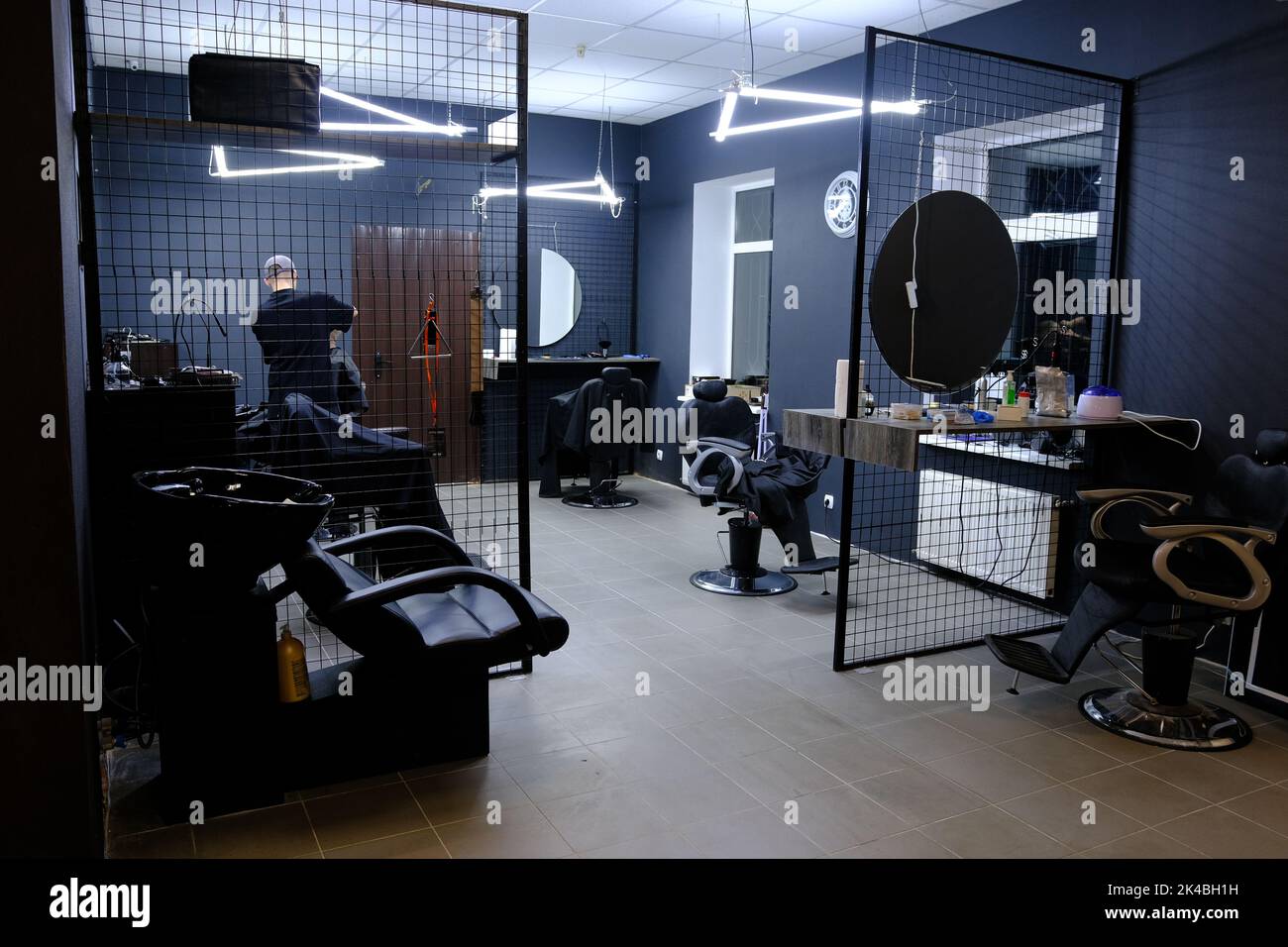 Stylish Vintage Barber Chairs In Black And Grey Interior. Theme, and