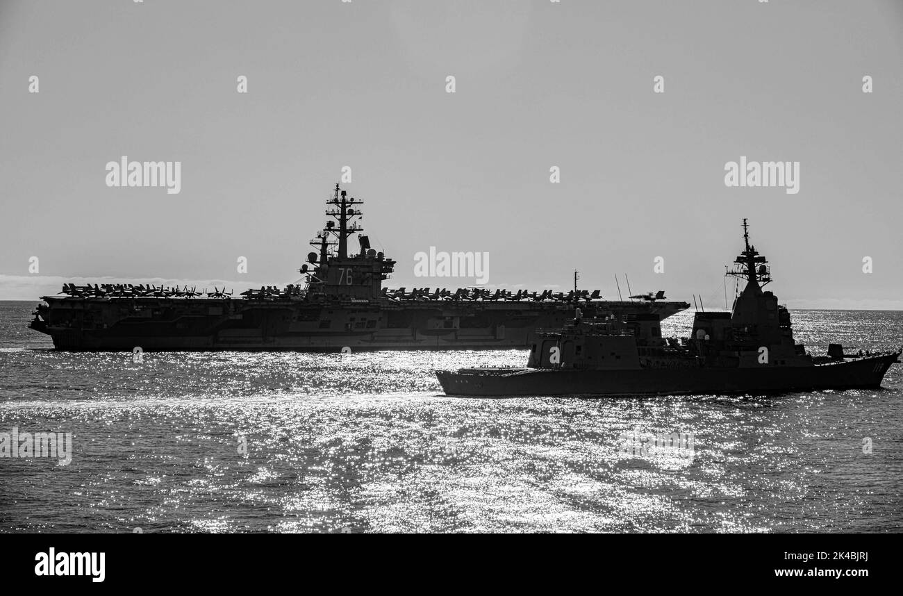 WATERS EAST OF THE KOREAN PENINSULA (Sept. 30, 2022) The U.S. Navy's only forward-deployed aircraft carrier, USS Ronald Reagan (CVN 76), USS Chancellorsville (CG 62), USS Benfold (DDG 65), Republic of Korea (ROK) ROKS Munmu the Great (DDH 976), and Japanese Maritime Self-Defense Force JS Asahi (DD-119), steam in formation in waters east of the Korean Peninsula, Sept. 30. Chancellorsville, operating as part of Carrier Strike Group (CSG) 5 is conducting a tri-lateral anti-submarine warfare exercise with the Japan Maritime Self-Defense Force and ROK Navy. The operations between the Reagan Strike Stock Photo