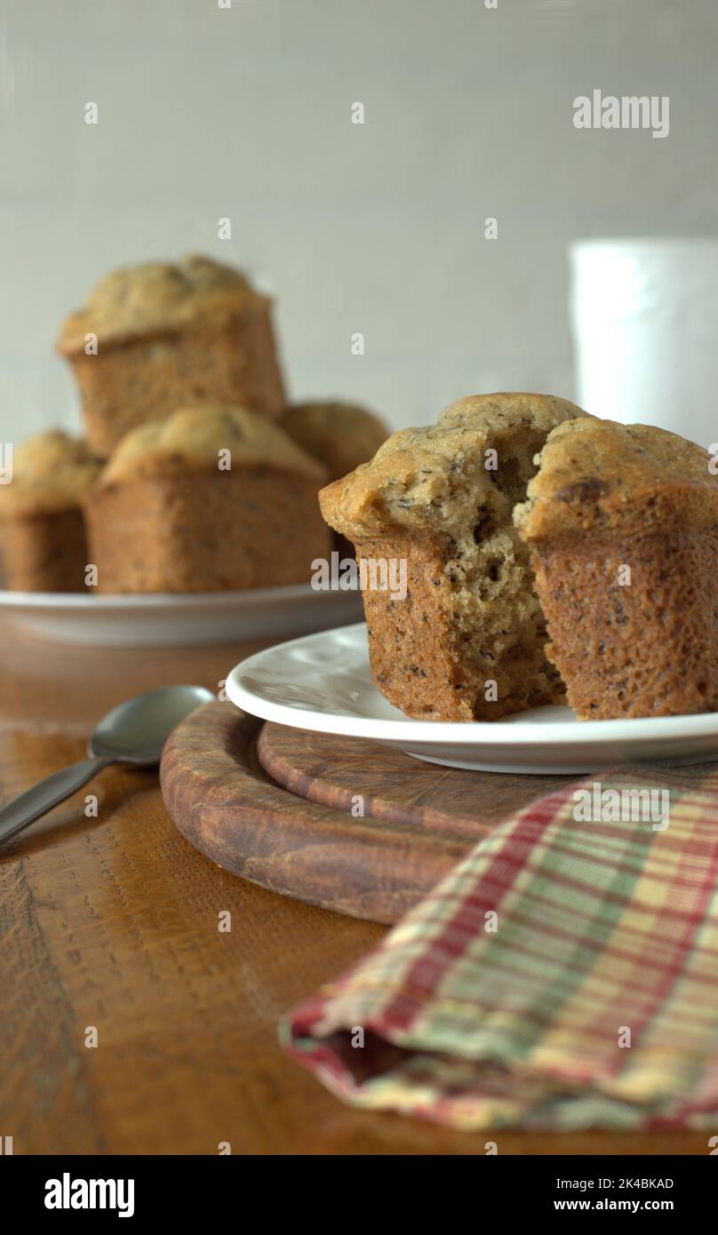 Banana muffins with butter on wooden table for breakfast. Stock Photo