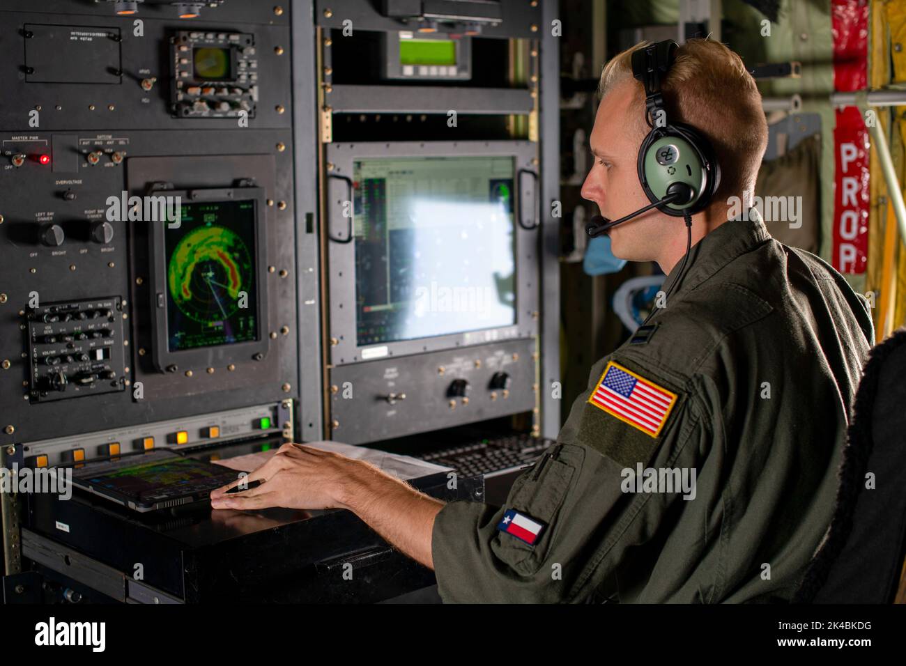 Capt. Davis White, 53rd Weather Reconnaissance Squadron aerial reconnaissance weather officer, monitors a radar screen during a flight into Hurricane Ian Sept. 27, 2022. The 53rd WRS, or Hurricane Hunters, fly missions into hurricanes to collect data for forecasters at the National Hurricane Center. (U.S. Air Force photo by Staff Sgt. Kristen Pittman)(U.S. Air Force photo by Staff Sgt. Kristen Pittman) Stock Photo