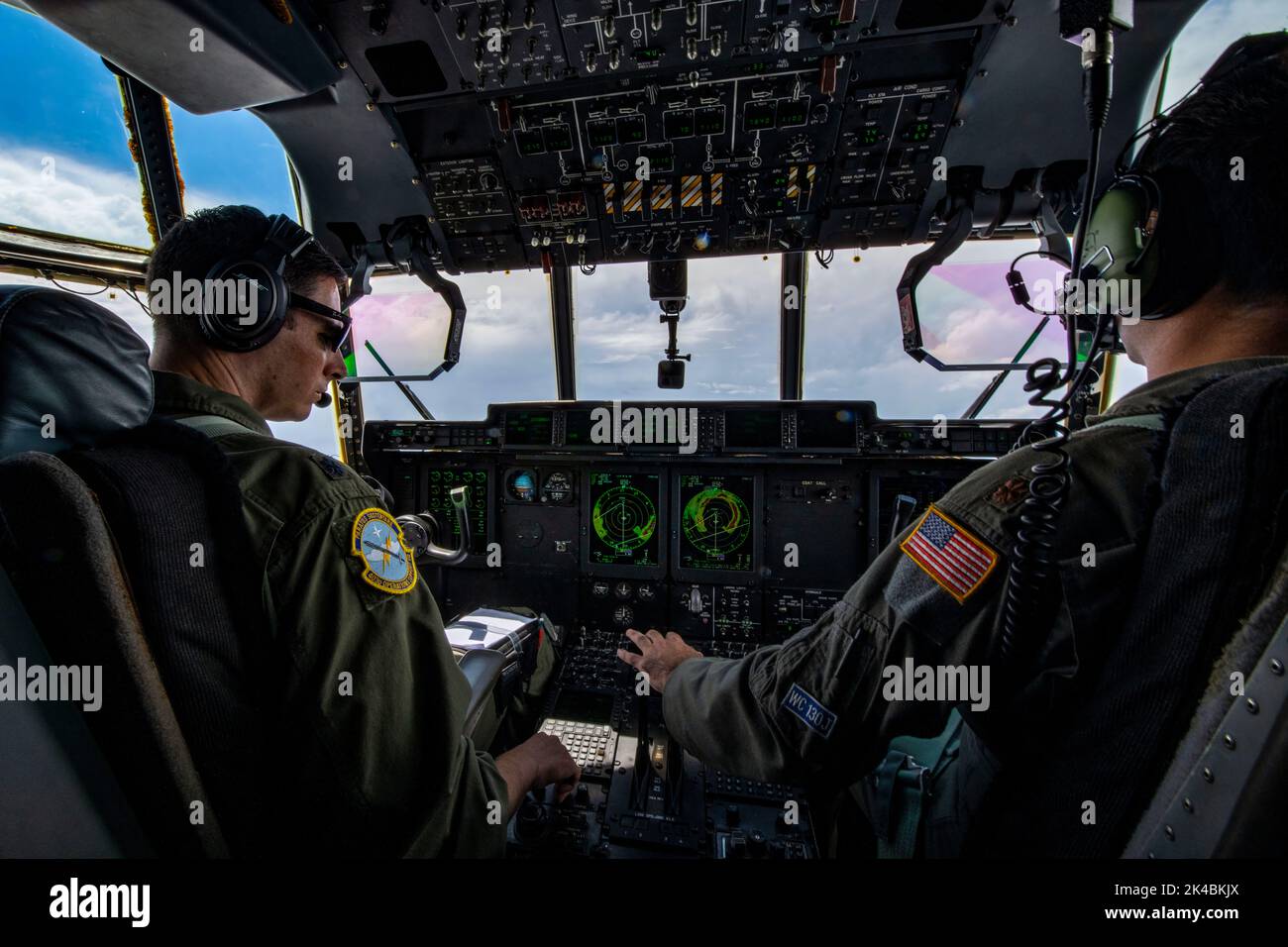 Lt. Col. Dave Gentile, WC-130J aircraft commander, and Maj. Alex Boykin, pilot, fly a 53rd Weather Reconnaissance aircraft into Hurricane Ian Sept. 27, 2022. The 53rd WRS, or Hurricane Hunters, fly missions into hurricanes to collect data for forecasters at the National Hurricane Center. (U.S. Air Force photo by Staff Sgt. Kristen Pittman) Stock Photo