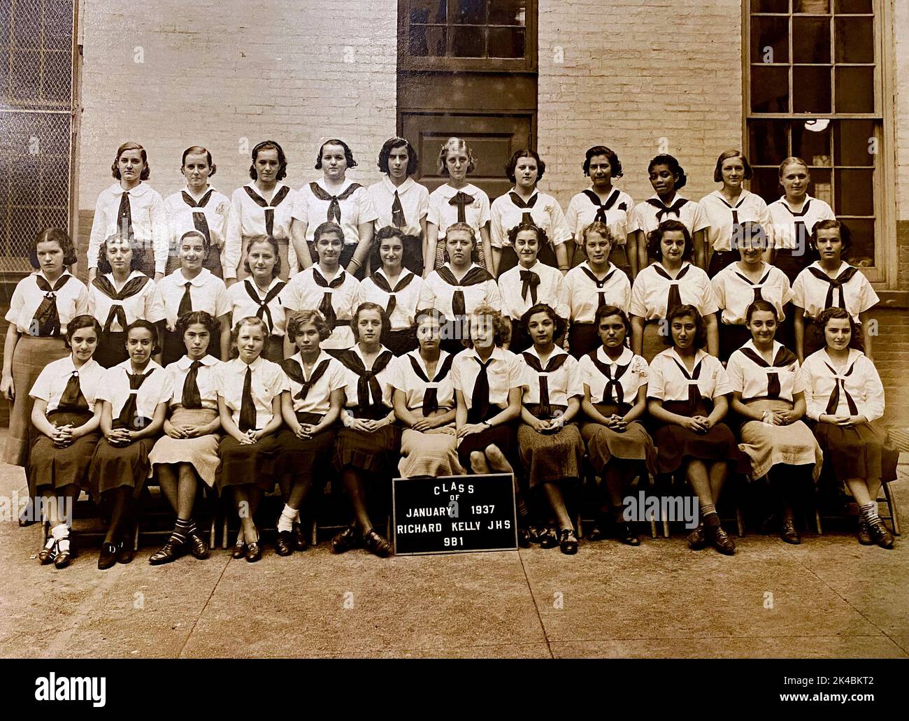Class of 1937 Richard Kelly Junior High School, NY featuring 36 female students in sailor shirts. Stock Photo