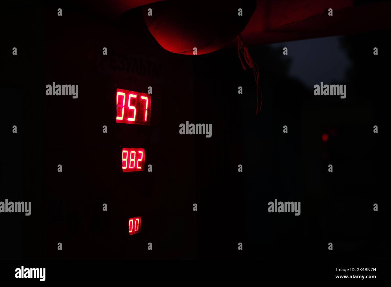 Red numbers on the display in the dark Stock Photo Alamy