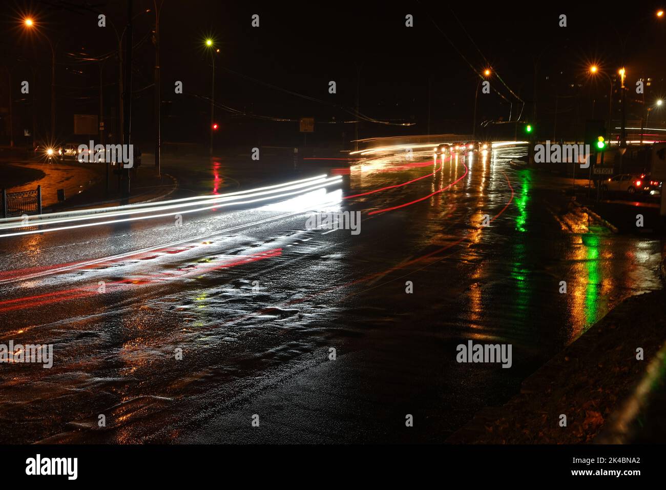 Lights of cars at night. Street lights. Night city. Longexposure photograph night road. Colored