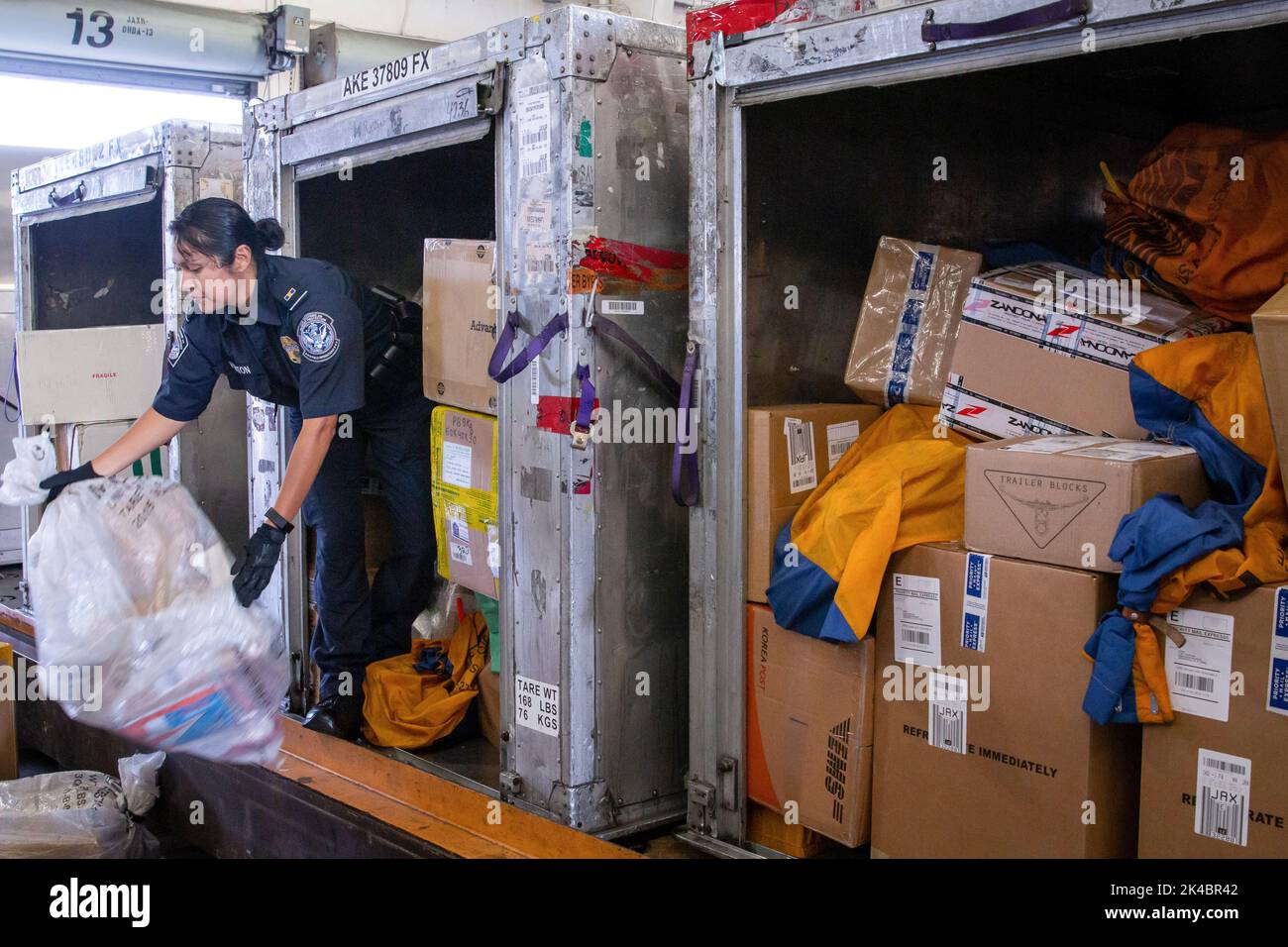 Customs and Border Protection officers assigned to the Area Port of Jacksonville, Florida perform consignment inspections of foreign packages arriving to the United States on Feb. 20. Photo by Ozzy Trevino, U.S. Customs and Border Protection Stock Photo