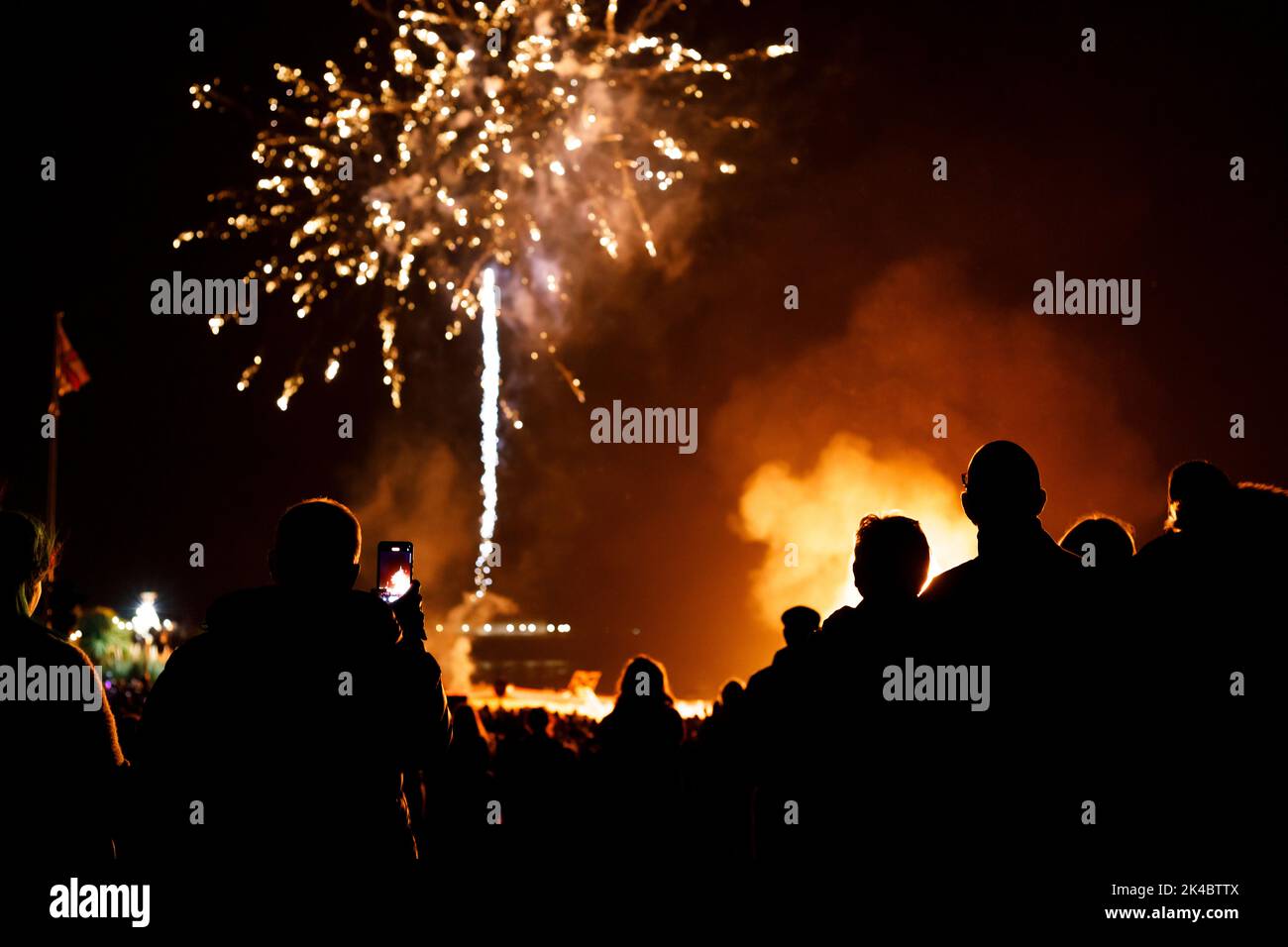 Eastbourne, UK. 1st Oct 2022. Spectators enjoy this evenings bonfire night celebrations in Eastbourne.  Towns in Sussex stagger their events so as not to clash with each other.  Eastbourne, East Sussex,UK. Credit: Ed Brown/Alamy Live News Stock Photo