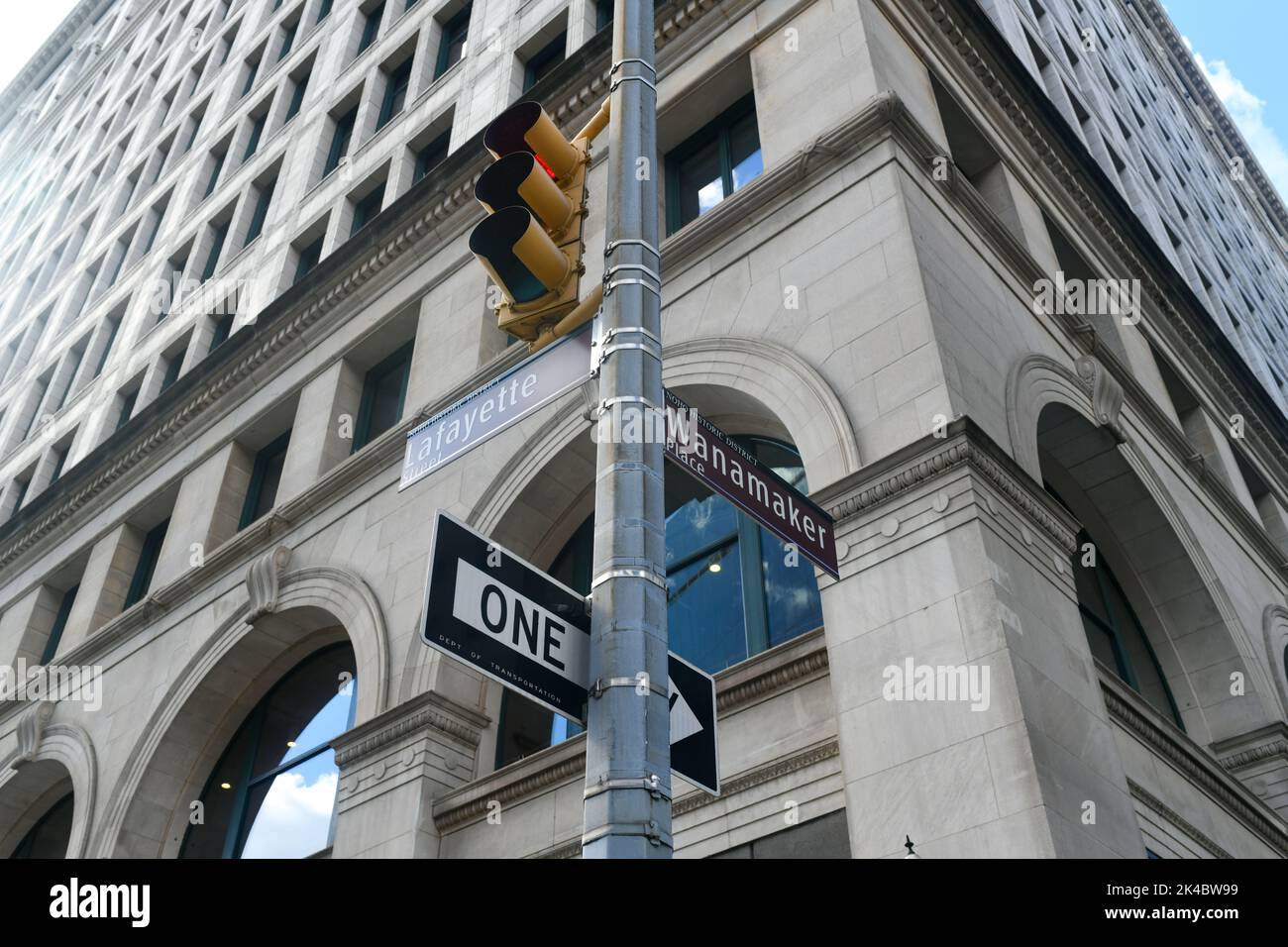 Lafayette Street and Wanamaker Place intersection street signs in the NoHo neighborhood of New York City. Stock Photo