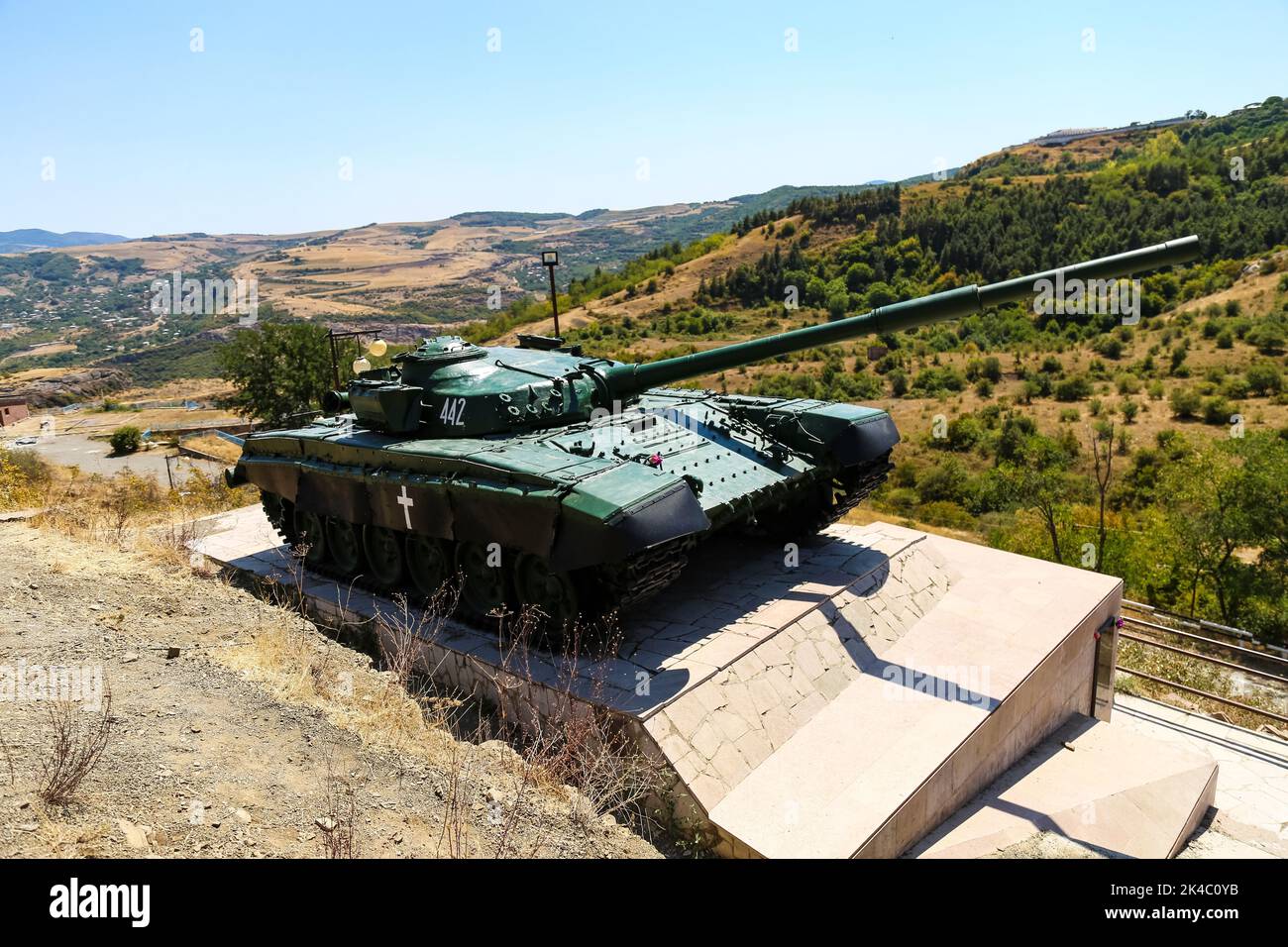 An old tank near beautiful hills Stock Photo