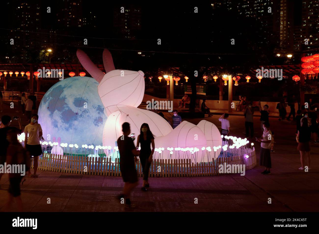 Masked members of the public enjoy the Mid-Autumn lantern and festival model display at Shatin Park, New Territories, Hong Kong 12th Sept 2022 Stock Photo
