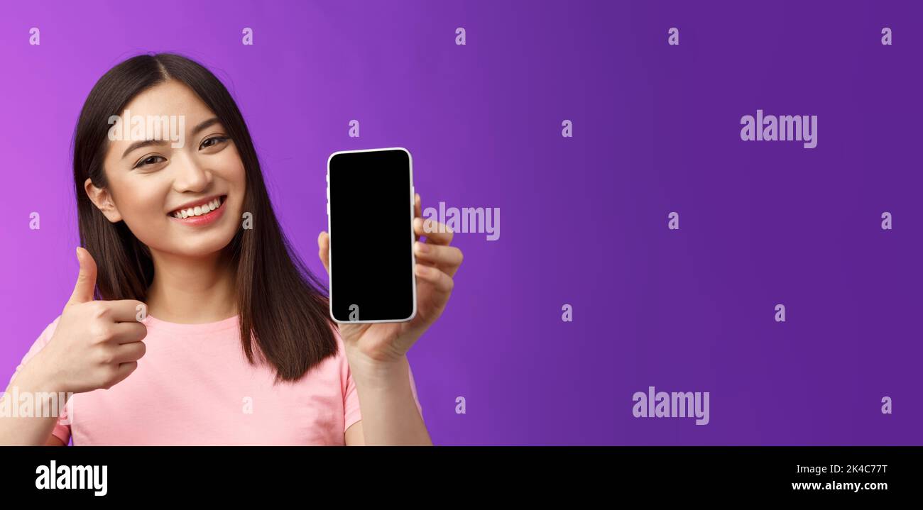Close-up satisfied happy attractive modern asian woman give positive ...