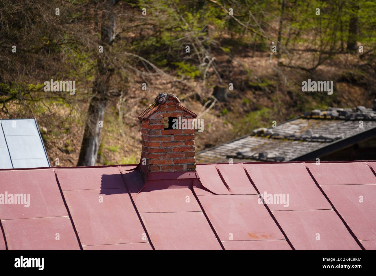 A closeup of a chimney on a rooftop Stock Photo
