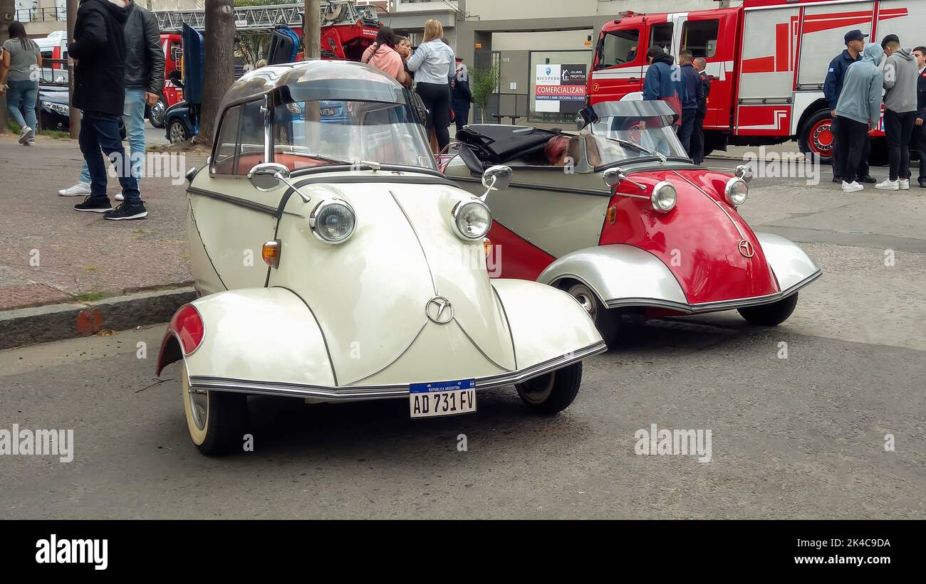 Old classic economy 1950s Messerschmitt KR200 Kabinenroller coupe and KR201 roadster one door three wheel German micro cars parked in the street. Stock Photo