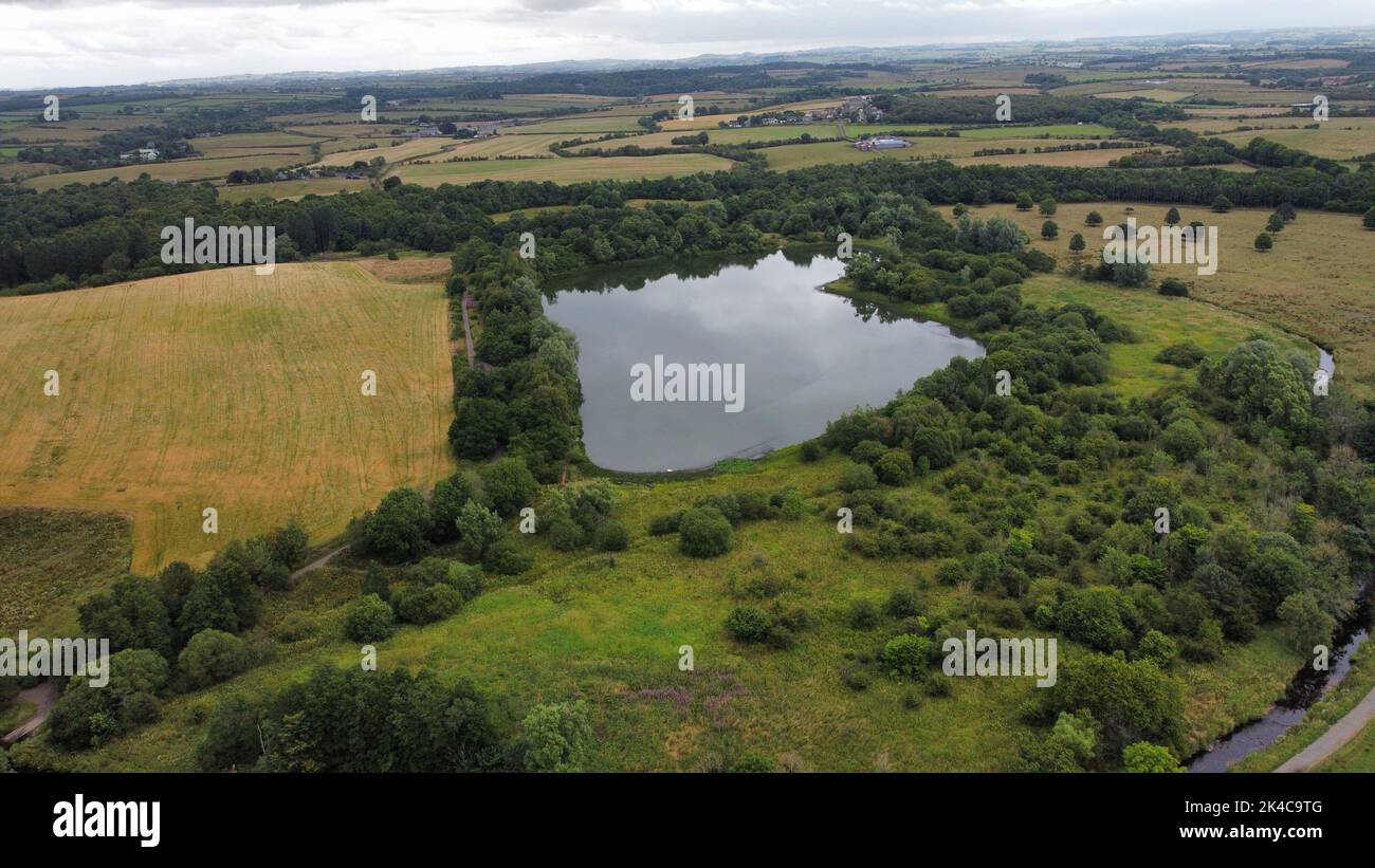An aerial view of a beautiful lake near the forest Stock Photo - Alamy