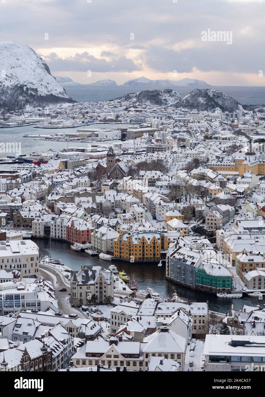 Winter evening view from Aksla mountain to the snowy town of Alesund in Norway Stock Photo
