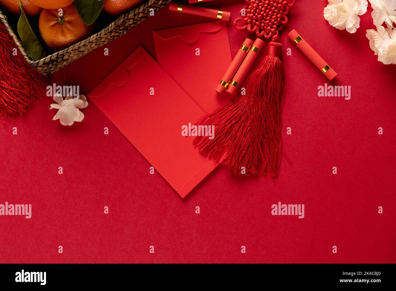 Composition of traditional chinese decorations and flowers on red