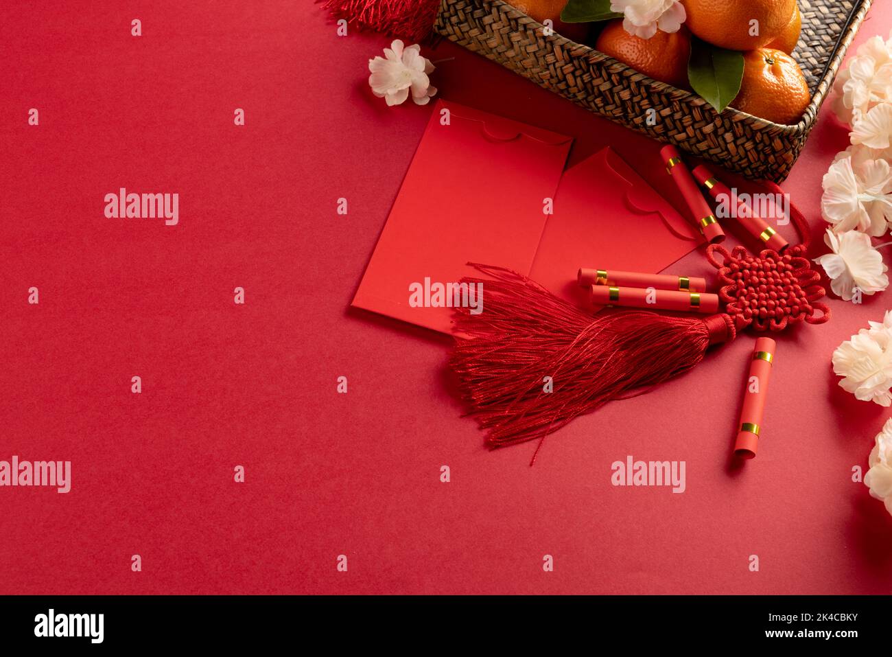 Composition of traditional chinese decorations and flowers on red