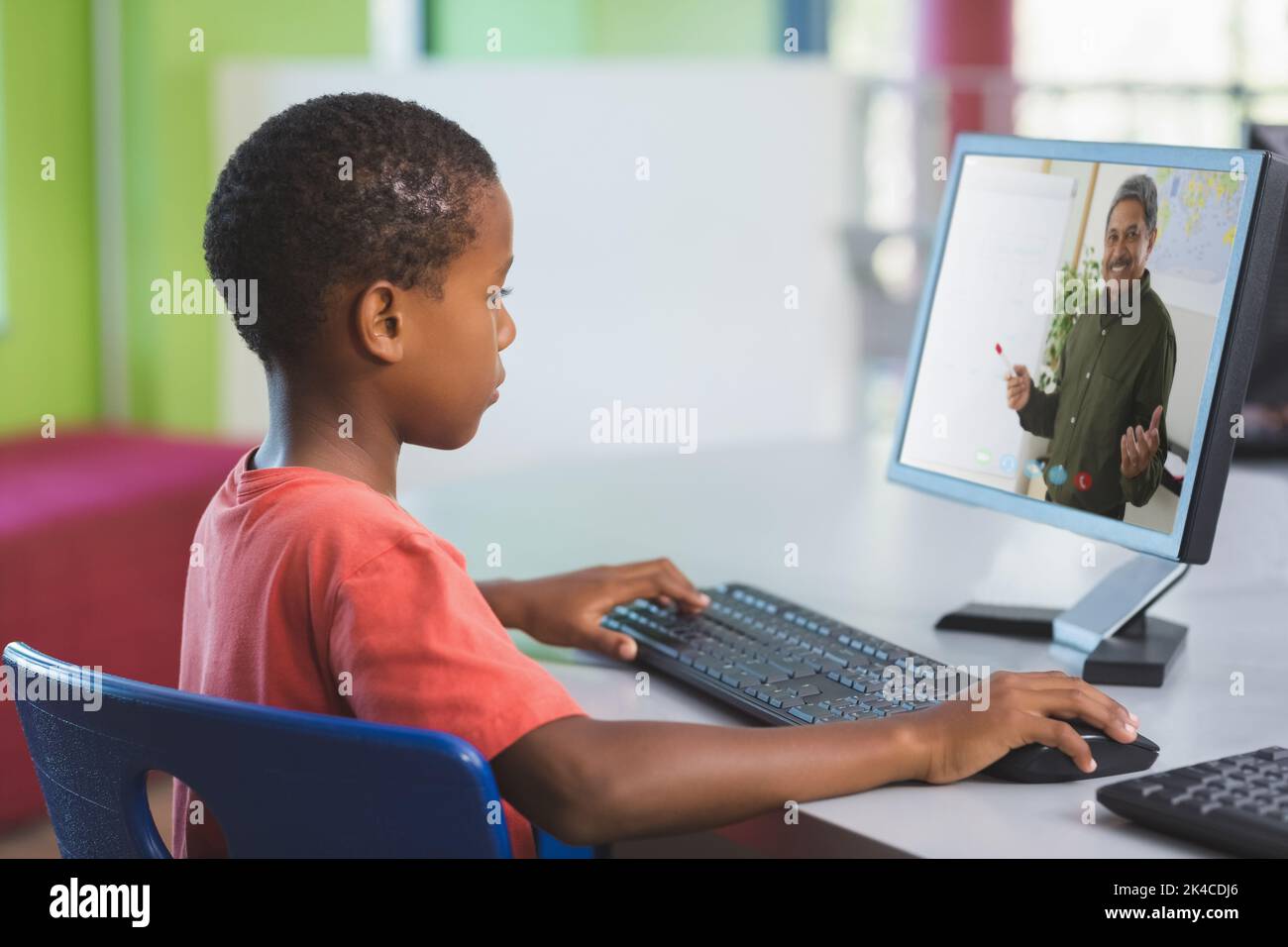 Male african american student having a video call with male teacher on ...