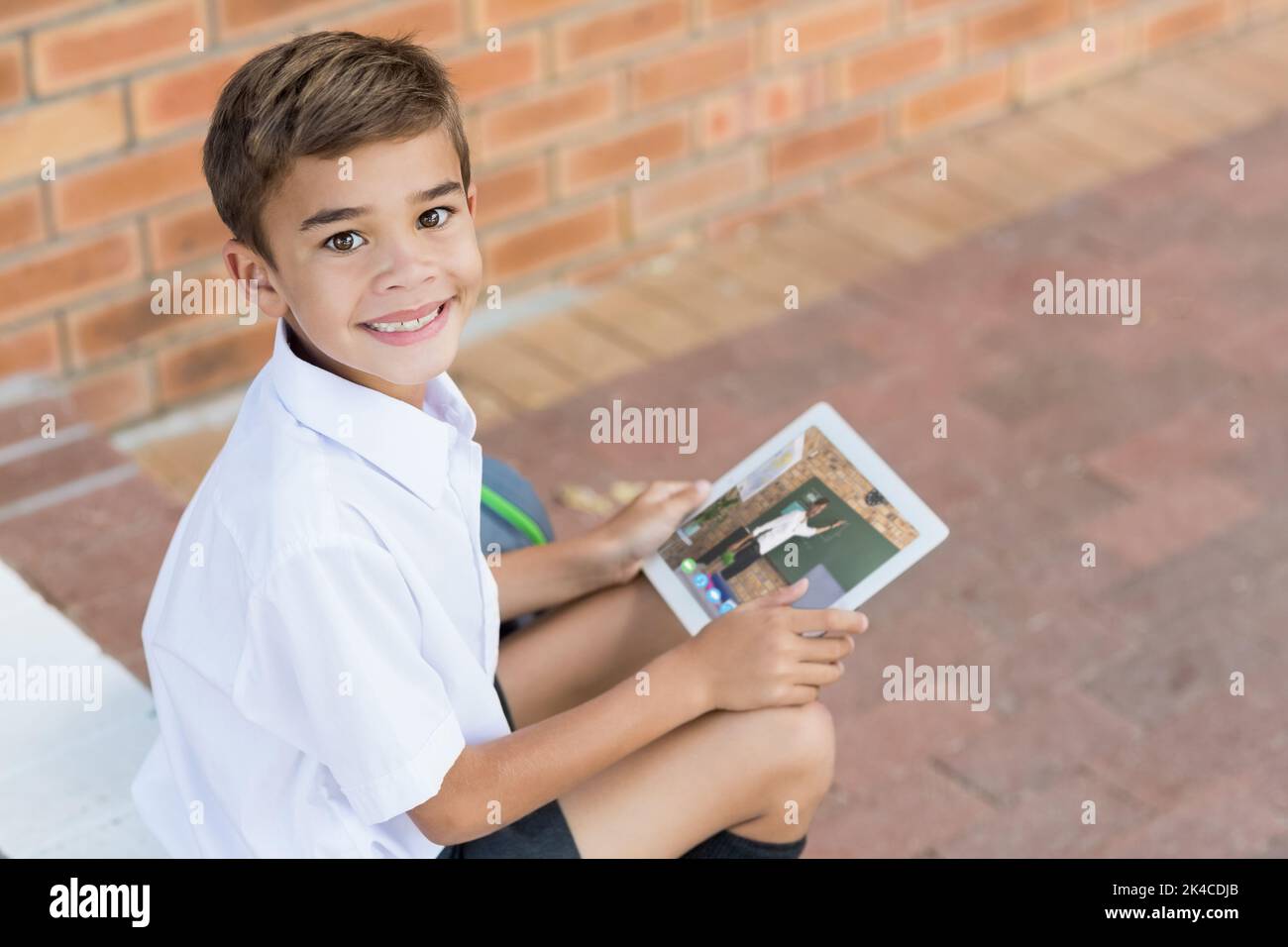 Portrait of male caucasian student having a video call with male ...