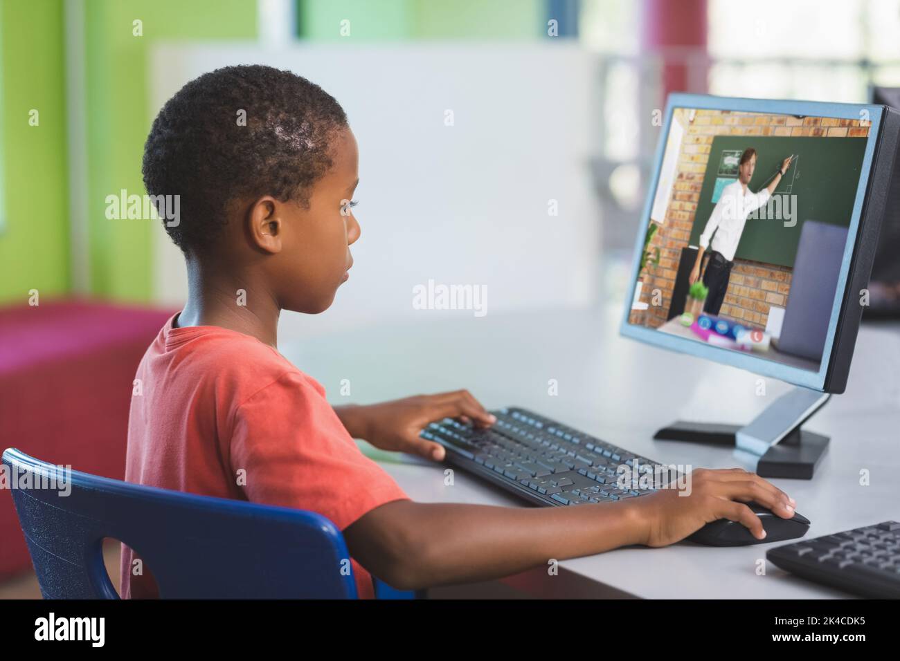 Male african american student having a video call with male teacher on ...