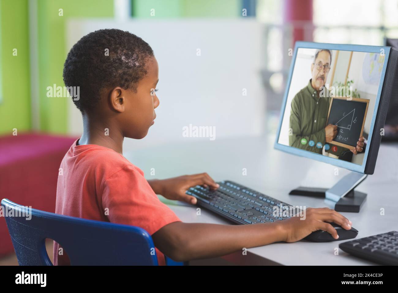 Male african american student having a video call with male teacher on ...
